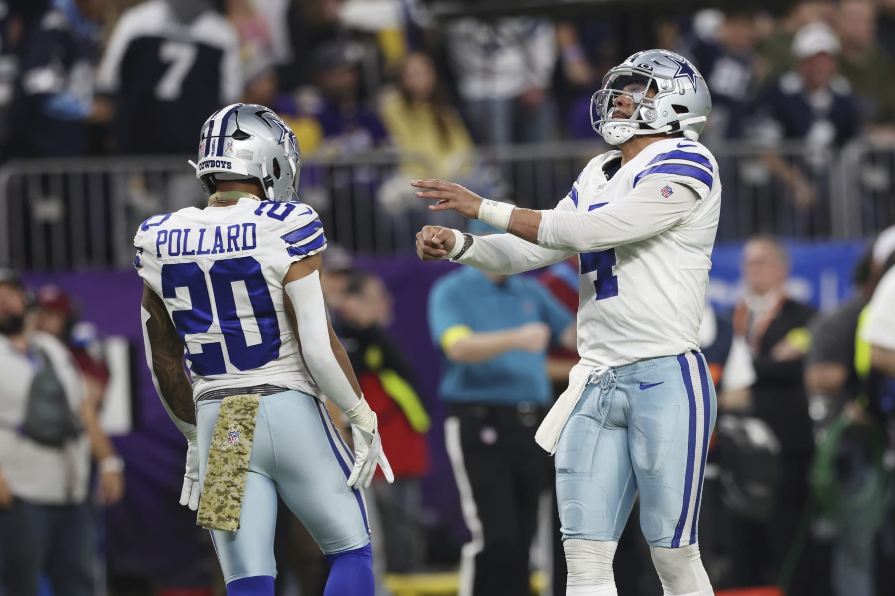 Dallas Cowboys quarterback Dak Prescott (4) celebrates with running back Tony Pollard (20) after Pollard scored a touchdown against the Minnesota Vikings during the first half of an NFL football game Sunday, Nov. 20, 2022 in Minneapolis. (AP Photo/Stacy Bengs)