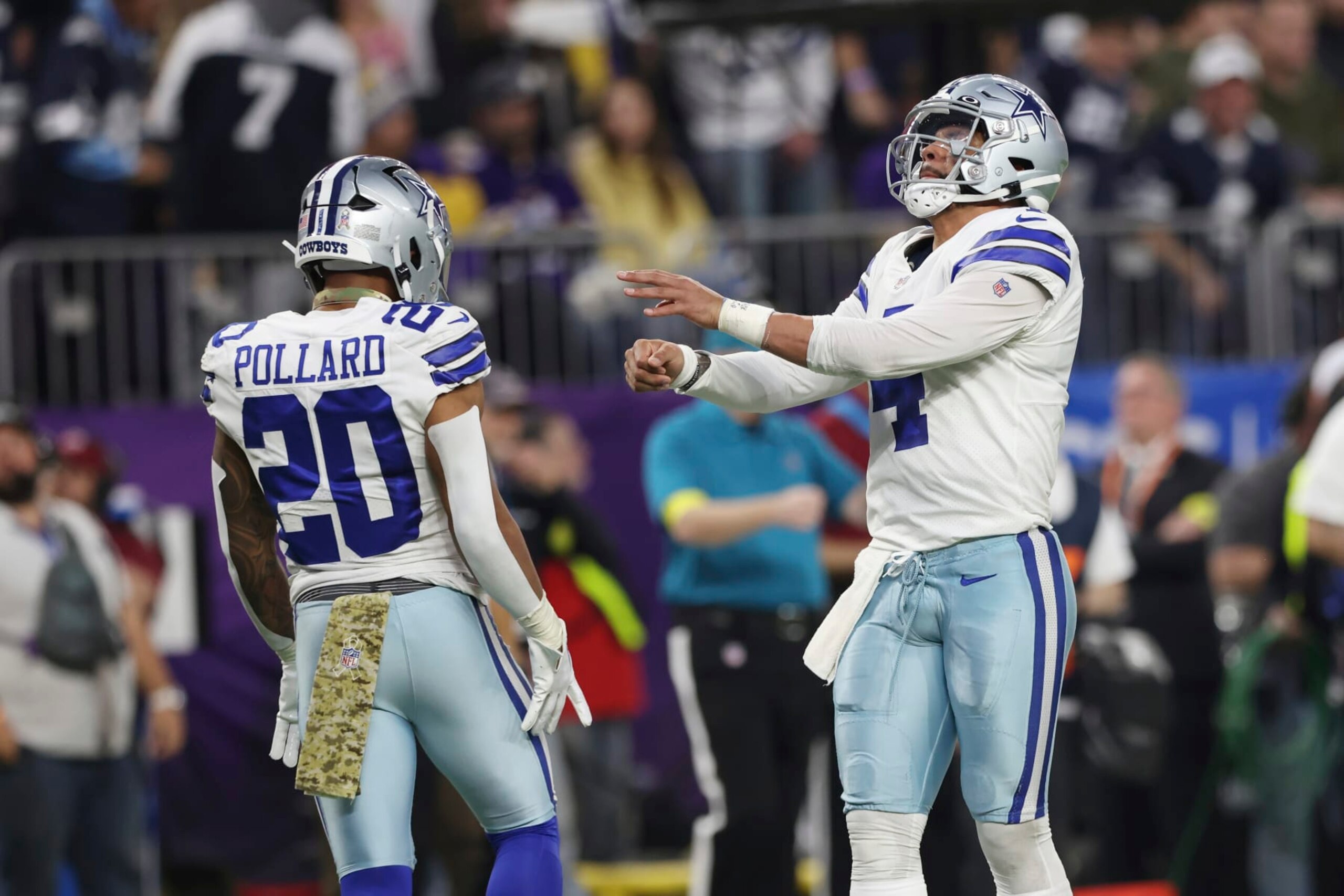 Dallas Cowboys quarterback Dak Prescott (4) celebrates with running back Tony Pollard (20) after Pollard scored a touchdown against the Minnesota Vikings during the first half of an NFL football game Sunday, Nov. 20, 2022 in Minneapolis. (AP Photo/Stacy Bengs) Dallas Cowboys quarterback Dak Prescott (4) celebrates with running back Tony Pollard (20) after Pollard scored a touchdown against the Minnesota Vikings during the first half of an NFL football game Sunday, Nov. 20, 2022 in Minneapolis. (AP Photo/Stacy Bengs)