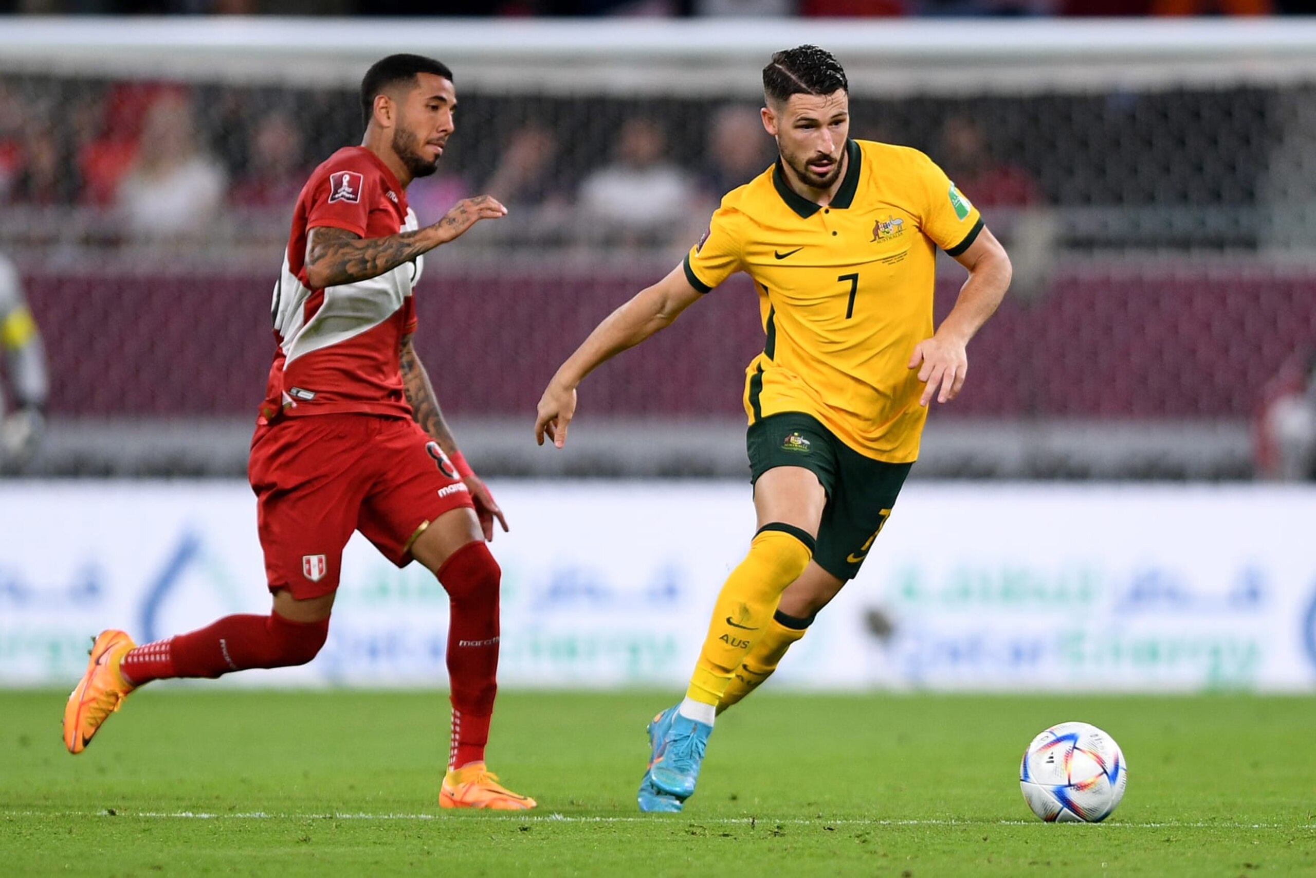 DOHA, QATAR - JUNE 13: Mathew Leckie of Australia competes in the 2022 FIFA World Cup Playoff match between Australia Socceroos and Peru at Ahmad Bin Ali Stadium on June 13, 2022 in Doha, Qatar. (Photo by Joe Allison/Getty Images)