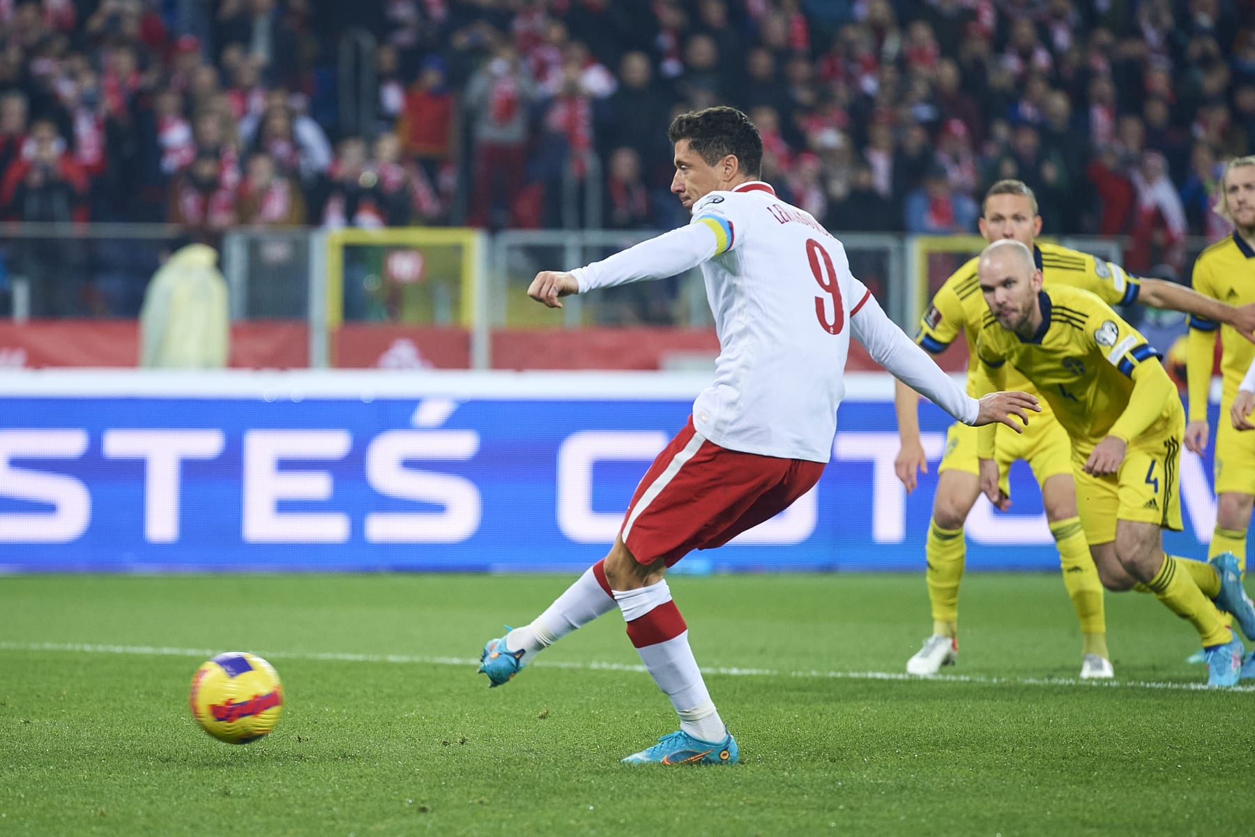 CHORZOW, POLAND - MARCH 29: Robert Lewandowski from Poland shoots goal from penalty kick during the 2022 FIFA World Cup Qualifier knockout round play-off match between Poland and Sweden at  Silesian Stadium on March 29, 2022 in Chorzow. (Photo by Adam Nurkiewicz/Getty Images)