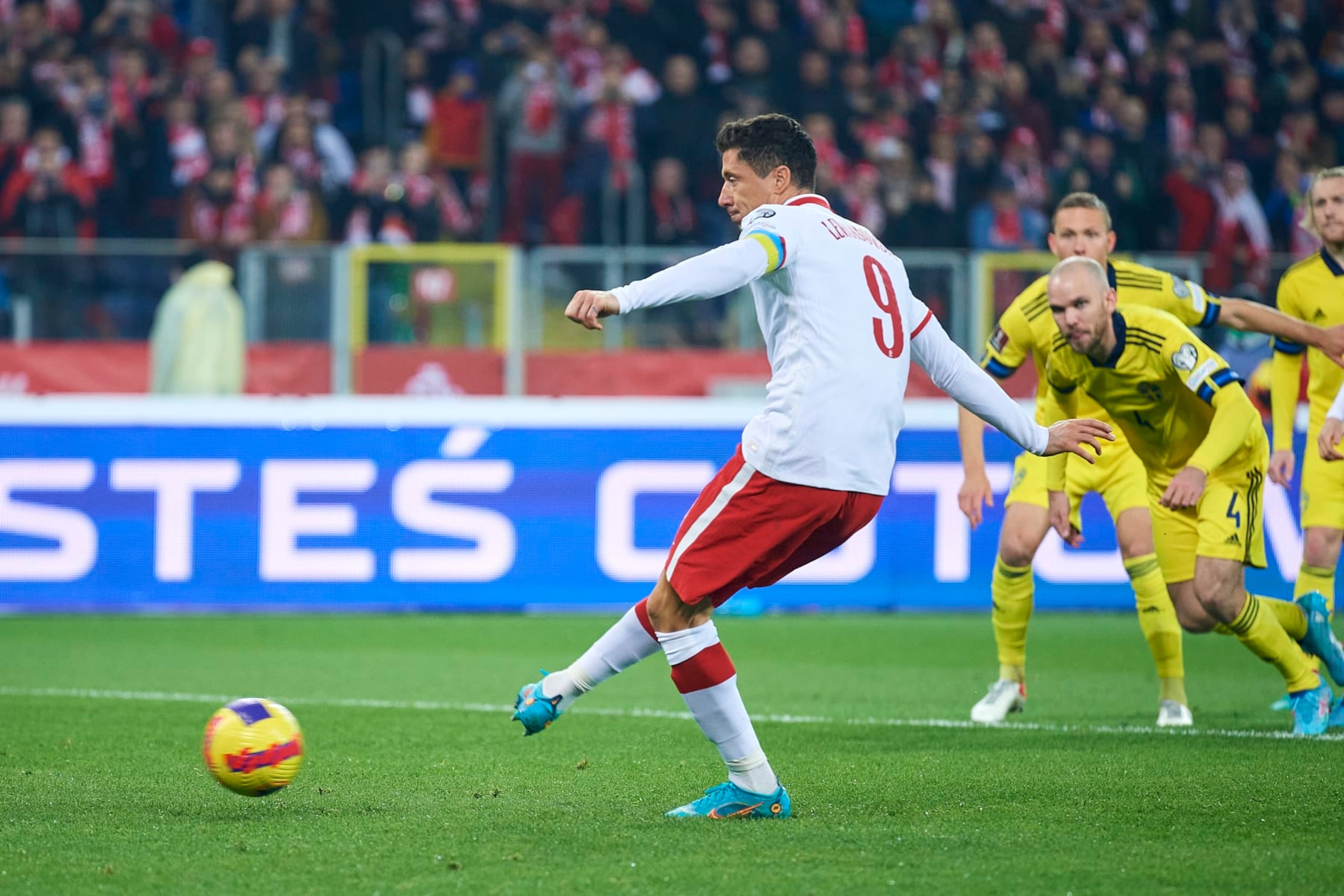 CHORZOW, POLAND - MARCH 29: Robert Lewandowski from Poland shoots goal from penalty kick during the 2022 FIFA World Cup Qualifier knockout round play-off match between Poland and Sweden at  Silesian Stadium on March 29, 2022 in Chorzow. (Photo by Adam Nurkiewicz/Getty Images)