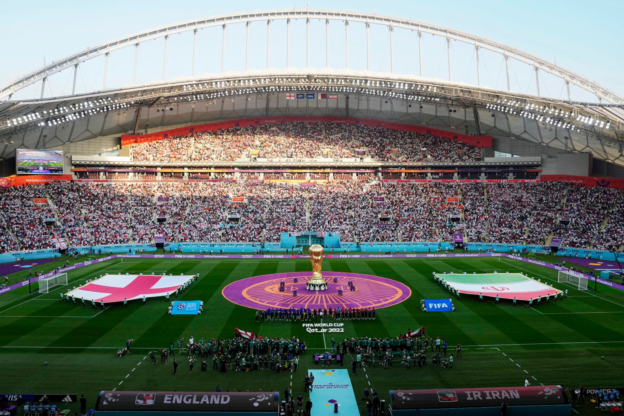 Teams line up prior the World Cup group B soccer match between England and Iran at the Khalifa International Stadium in Doha, Qatar, Monday, Nov. 21, 2022. (AP Photo/Pavel Golovkin)