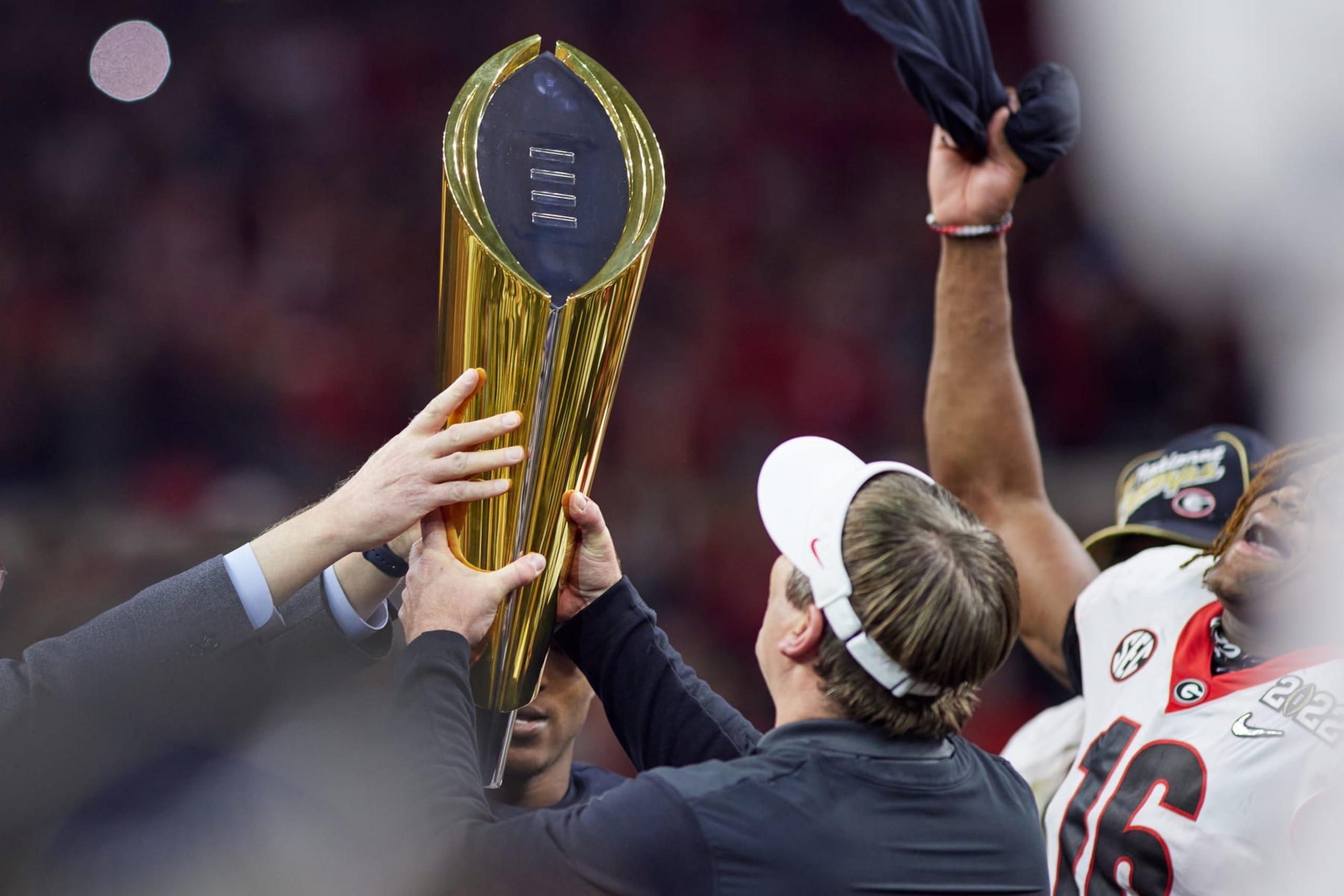 INDIANAPOLIS, IN - JANUARY 10: Georgia Bulldogs head coach Kirby Smart holds the national championship trophy after the Alabama Crimson Tide versus the Georgia Bulldogs in the College Football Playoff National Championship, on January 10, 2022, at Lucas Oil Stadium in Indianapolis, IN.(Photo by Robin Alam/Icon Sportswire via Getty Images)
