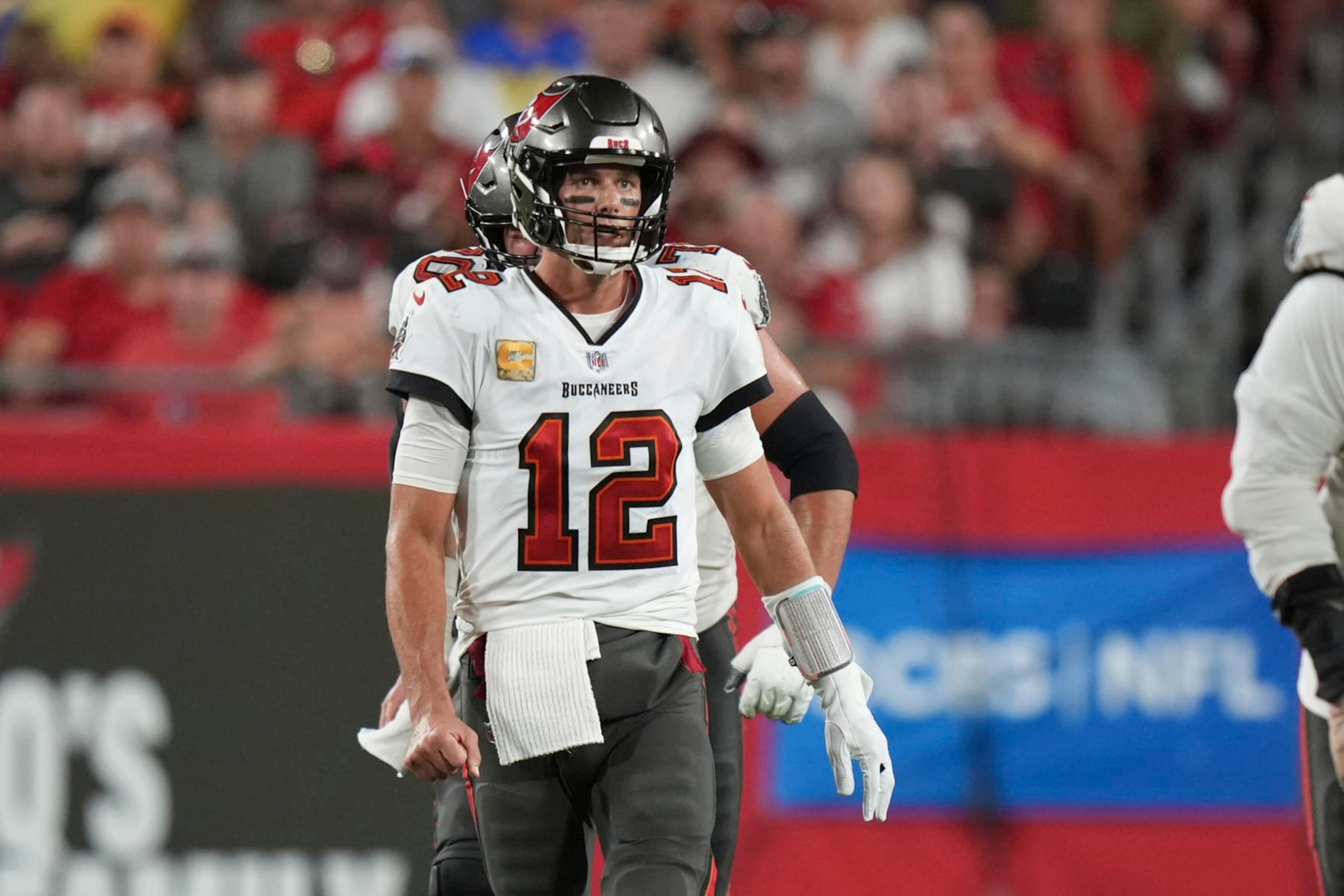 Tampa Bay Buccaneers quarterback Tom Brady (12) watches the play unfold after his completion to pass 100,000 yards passing during an NFL football game against the Los Angeles Rams, Sunday, Nov. 1, 2022 in Tampa, Fla. The Buccaneers defeat the Rams 16-13. (AP Photo/Peter Joneleit) Tampa Bay Buccaneers quarterback Tom Brady (12) watches the play unfold after his completion to pass 100,000 yards passing during an NFL football game against the Los Angeles Rams, Sunday, Nov. 1, 2022 in Tampa, Fla. The Buccaneers defeat the Rams 16-13. (AP Photo/Peter Joneleit)