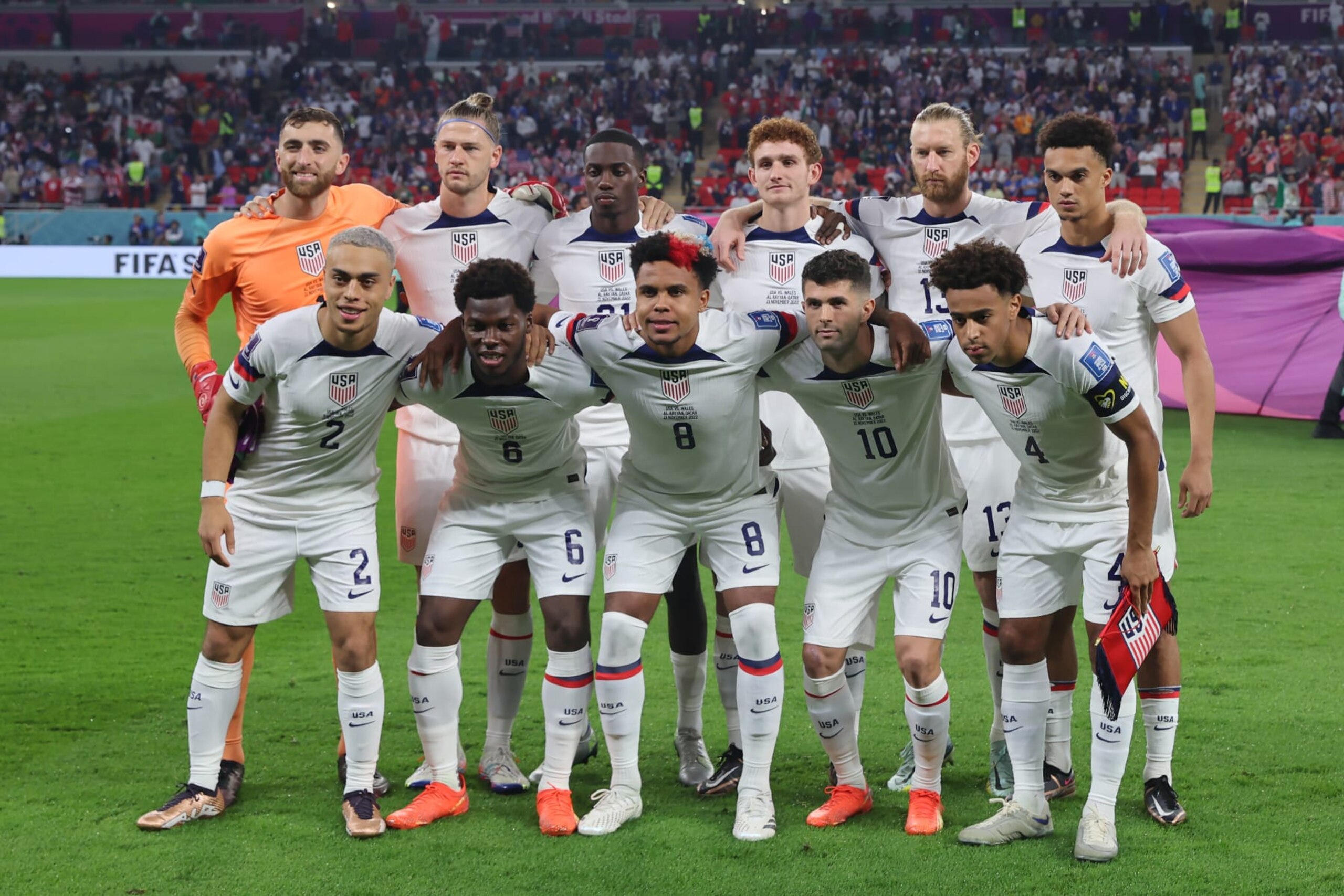DOHA, QATAR - NOVEMBER 21: The USA starting eleven line up for a team photo prior to kick off, back row ( L to R ); Matt Turner, Walker Zimmerman, Tim Weah, Josh Sargent, Tim Ream and Antonee Robinson, front row ( L to R ); Sergino Dest, Yunus Musah, Weston McKennie, Christian Pulisic and Tyler Adams, in the FIFA World Cup Qatar 2022 Group B match between USA and Wales at Ahmad Bin Ali Stadium on November 21, 2022 in Doha, Qatar. (Photo by Youssef Loulidi/Fantasista/Getty Images)