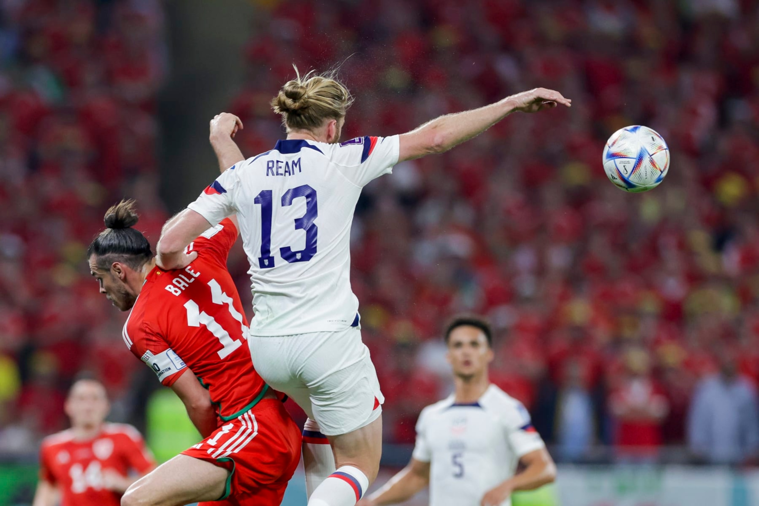 DOHA, QATAR - NOVEMBER 21: Gareth Bale of Wales and Tim Ream of USA battle for the ball during the FIFA World Cup Qatar 2022 Group B match between USA and Wales at Ahmad Bin Ali Stadium on November 21, 2022 in Doha, Qatar. (Photo by Mohammad Karamali/DeFodi Images via Getty Images)