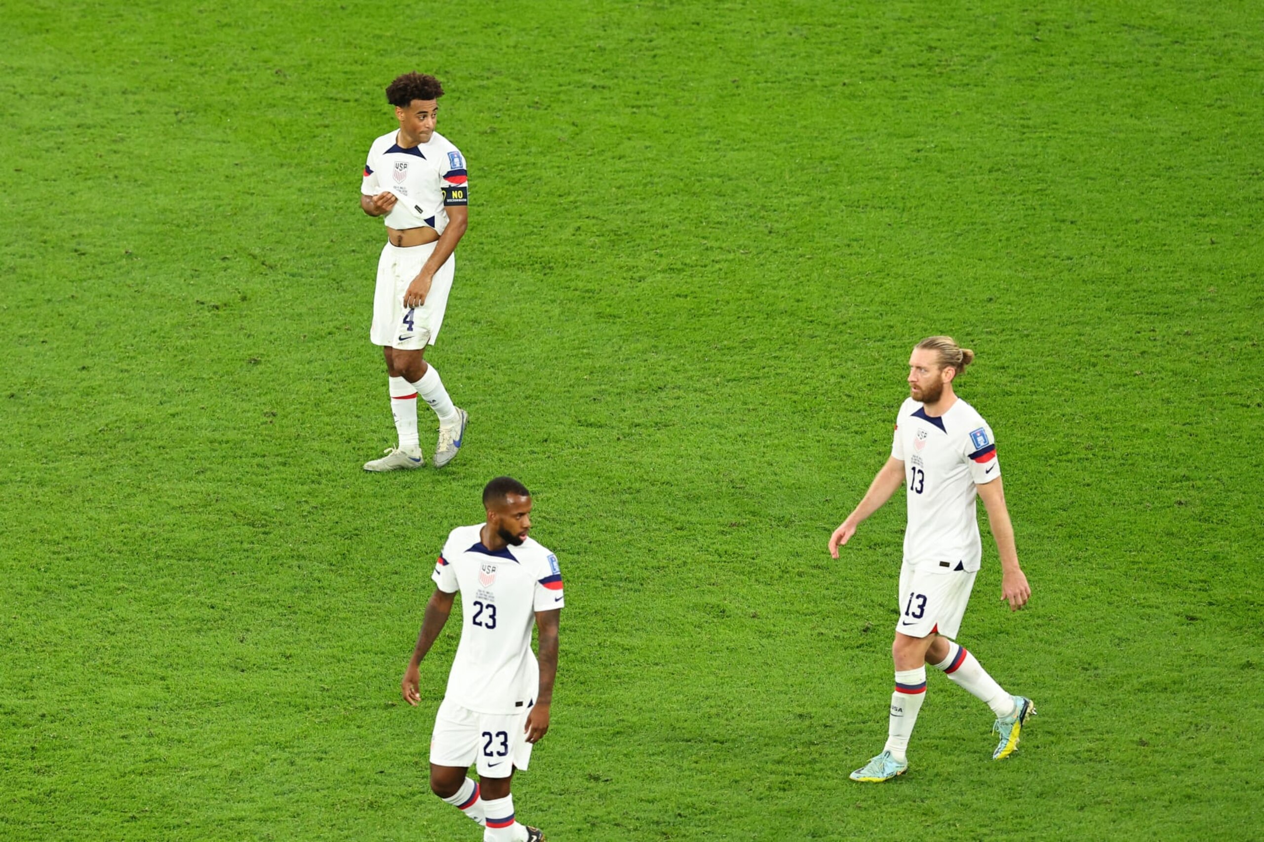DOHA, QATAR - NOVEMBER 21:  Dejected players of USA after conceding during the FIFA World Cup Qatar 2022 Group B match between USA and Wales at Ahmad Bin Ali Stadium on November 21, 2022 in Doha, Qatar. (Photo by Robbie Jay Barratt - AMA/Getty Images)