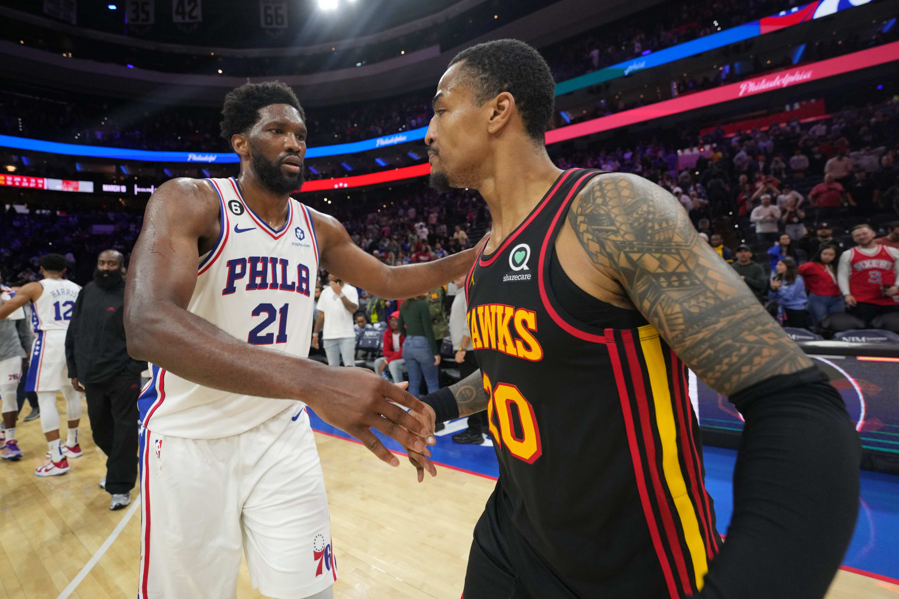 PHILADELPHIA, PA - NOVEMBER 12: Joel Embiid #21 of the Philadelphia 76ers hugs John Collins #20 of the Atlanta Hawks after the game on November 12, 2022 at the Wells Fargo Center in Philadelphia, Pennsylvania NOTE TO USER: User expressly acknowledges and agrees that, by downloading and/or using this Photograph, user is consenting to the terms and conditions of the Getty Images License Agreement. Mandatory Copyright Notice: Copyright 2022 NBAE (Photo by Jesse D. Garrabrant/NBAE via Getty Images)