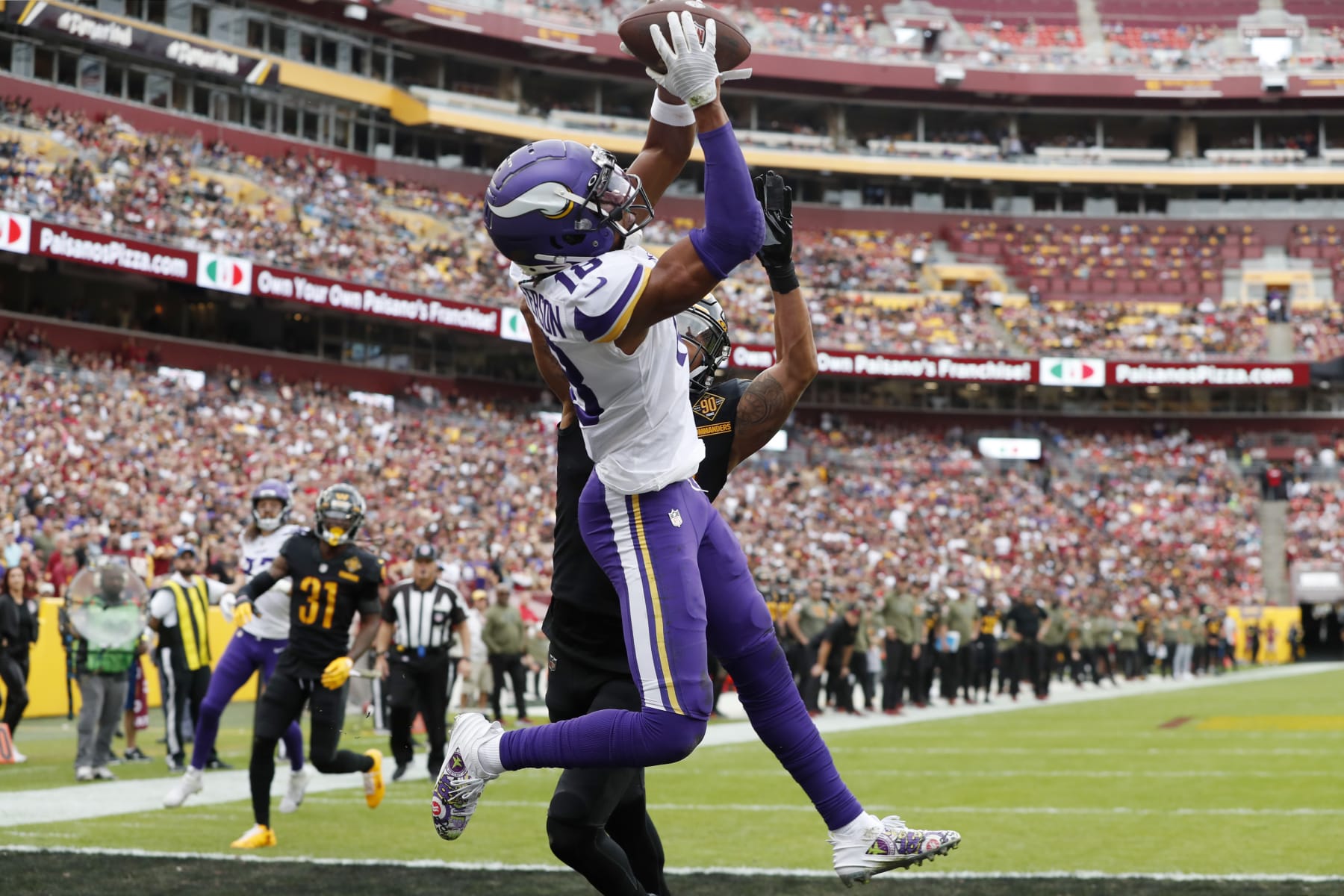 LANDOVER, MARYLAND - NOVEMBER 06: Justin Jefferson #18 of the Minnesota Vikings catches a pass for a touchdown in the first quarter of the game against the Washington Commanders at FedExField on November 06, 2022 in Landover, Maryland. (Photo by Todd Olszewski/Getty Images)