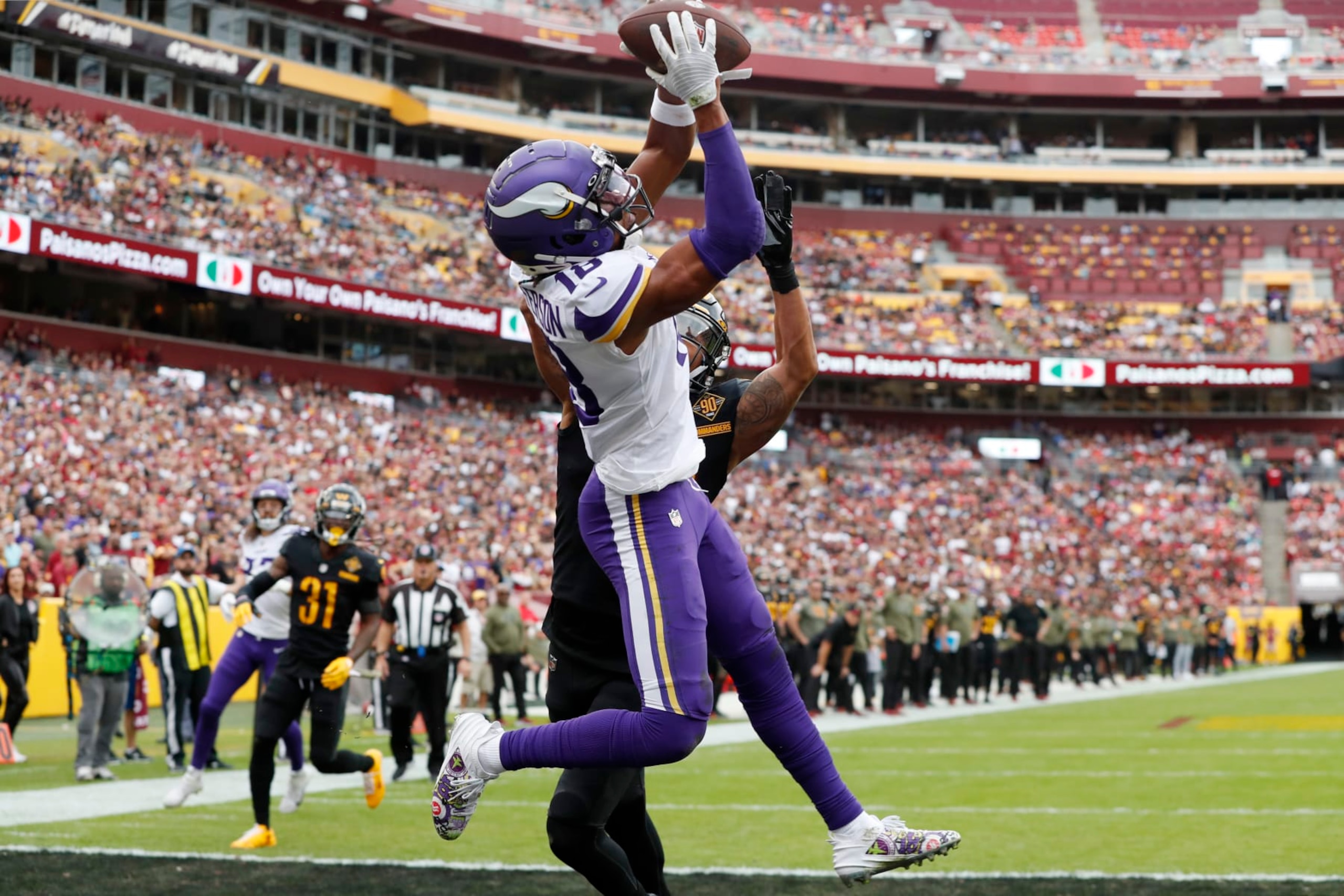 LANDOVER, MARYLAND - NOVEMBER 06: Justin Jefferson #18 of the Minnesota Vikings catches a pass for a touchdown in the first quarter of the game against the Washington Commanders at FedExField on November 06, 2022 in Landover, Maryland. (Photo by Todd Olszewski/Getty Images) LANDOVER, MARYLAND - NOVEMBER 06: Justin Jefferson #18 of the Minnesota Vikings catches a pass for a touchdown in the first quarter of the game against the Washington Commanders at FedExField on November 06, 2022 in Landover, Maryland. (Photo by Todd Olszewski/Getty Images)