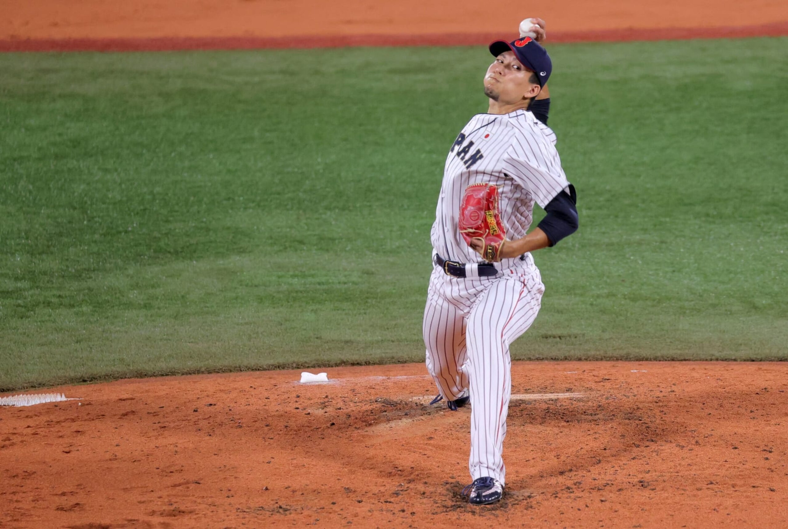 Japan's relief pitcher Koudai Senga hurls the ball during the sixth inning of the Tokyo 2020 Olympic Games baseball gold medal game between USA and Japan at Yokohama Baseball Stadium in Yokohama, Japan, on August 7, 2021. (Photo by KAZUHIRO FUJIHARA / AFP) (Photo by KAZUHIRO FUJIHARA/AFP via Getty Images)