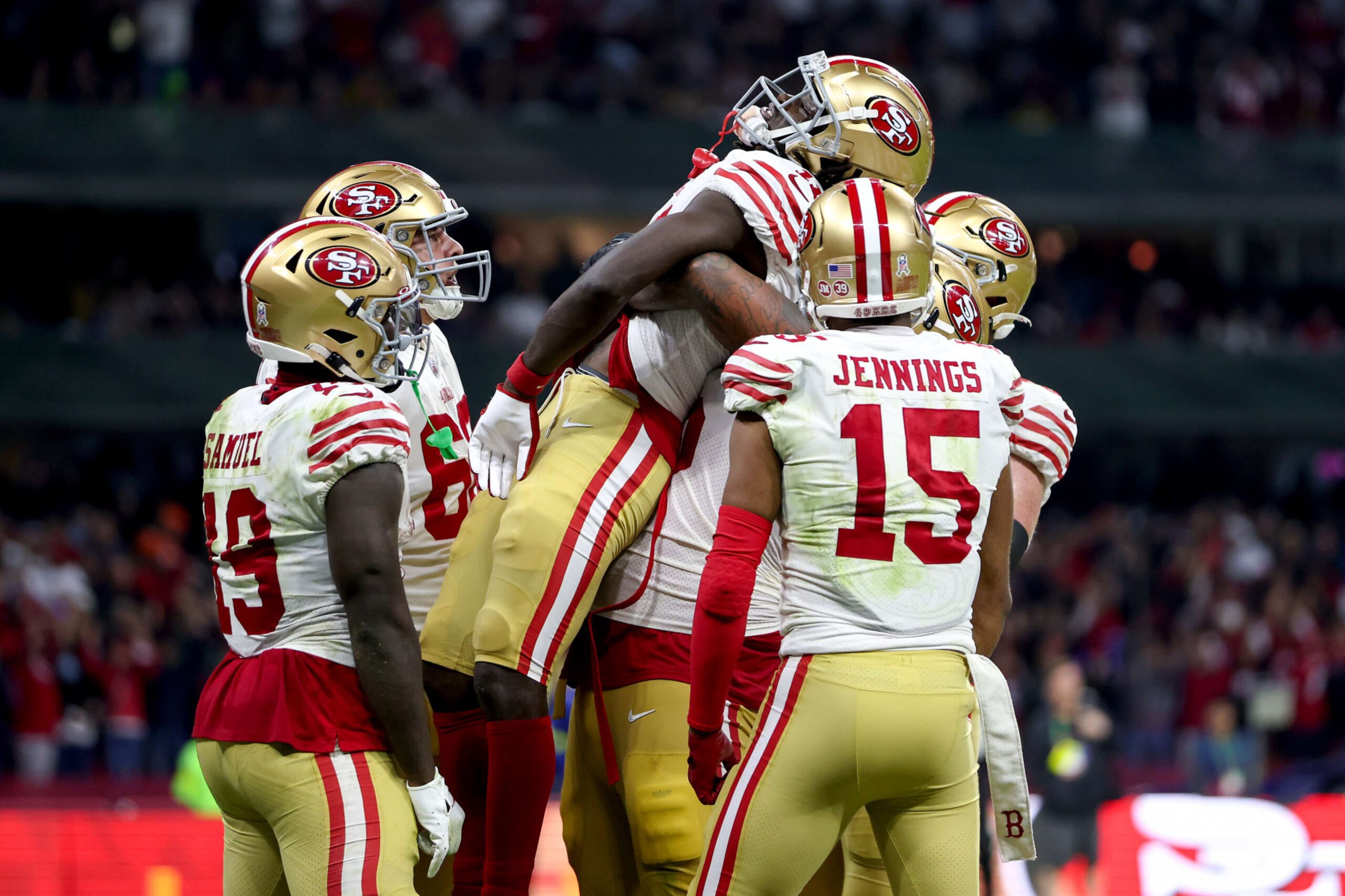 MEXICO CITY, MEXICO - NOVEMBER 21: Brandon Aiyuk #11 of the San Francisco 49ers celebrates with teammates after scoring a touchdown against the Arizona Cardinals during the third quarter at Estadio Azteca on November 21, 2022 in Mexico City, Mexico. (Photo by Sean M. Haffey/Getty Images)
