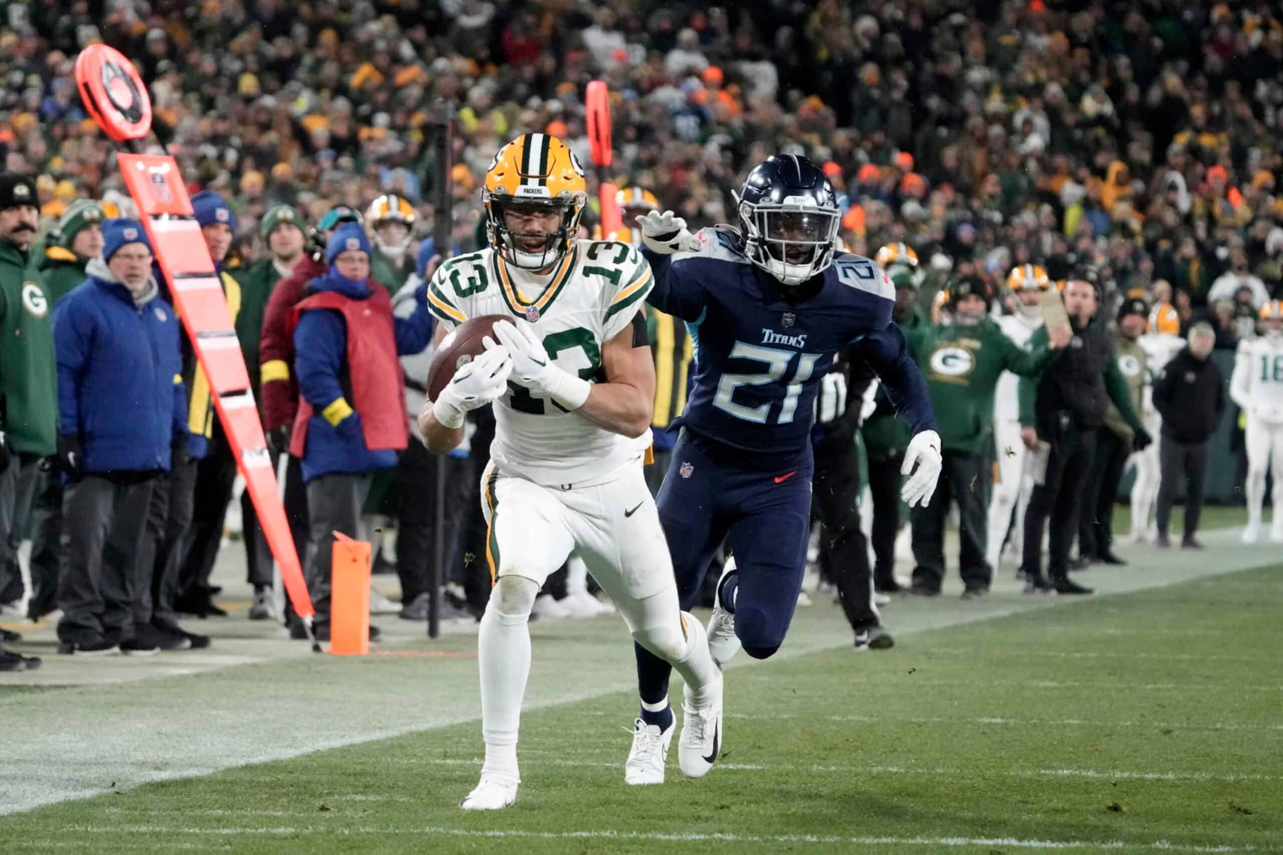 Green Bay Packers wide receiver Allen Lazard (13) catches a pass as Tennessee Titans cornerback Roger McCreary (21) defends during the second half of an NFL football game Thursday, Nov. 17, 2022, in Green Bay, Wis. (AP Photo/Morry Gash) Green Bay Packers wide receiver Allen Lazard (13) catches a pass as Tennessee Titans cornerback Roger McCreary (21) defends during the second half of an NFL football game Thursday, Nov. 17, 2022, in Green Bay, Wis. (AP Photo/Morry Gash)