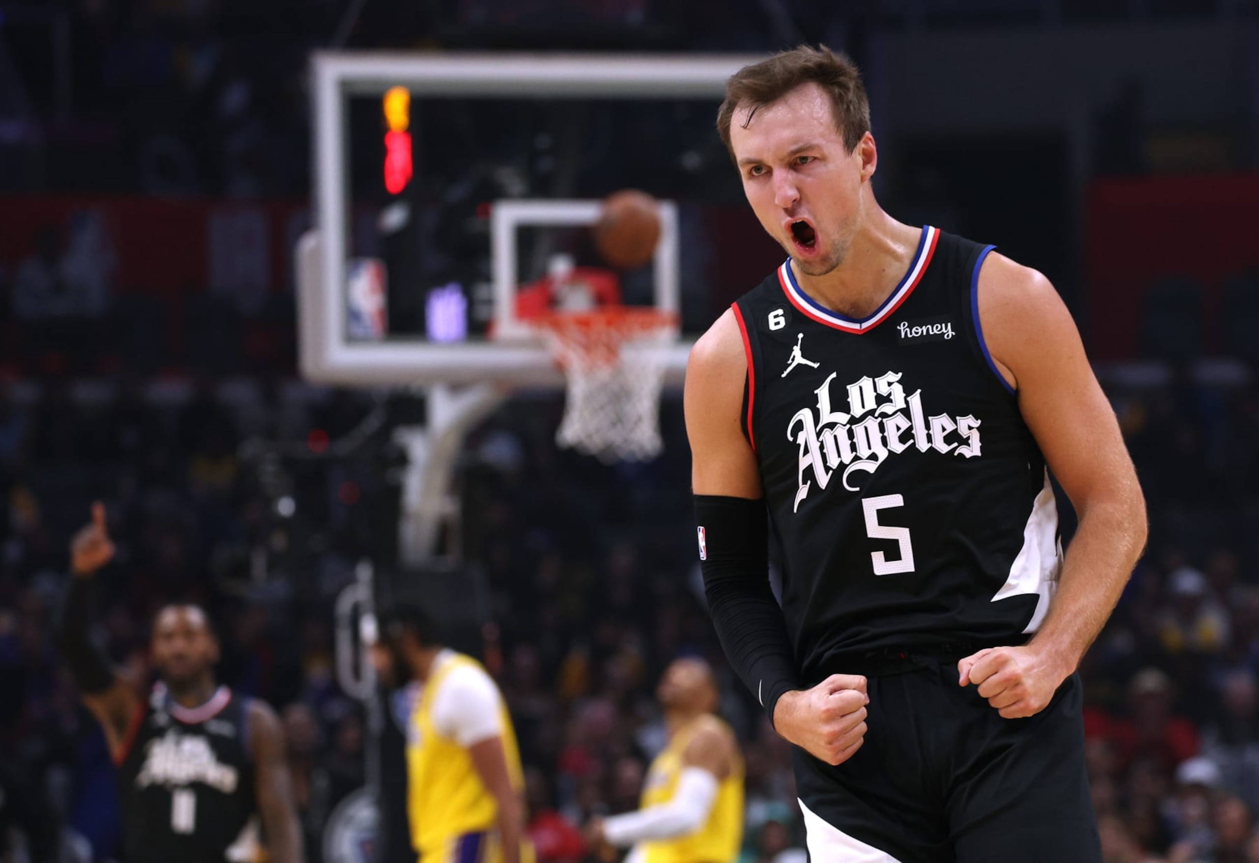 LOS ANGELES, CALIFORNIA - NOVEMBER 09: la5 celebrates his three pointer during the first quarter against the Los Angeles Lakers at Crypto.com Arena on November 09, 2022 in Los Angeles, California. NOTE TO USER: User expressly acknowledges and agrees that, by downloading and or using this Photograph, User is consenting to the terms and conditions of the Getty Images License Agreement. Mandatory Copyright Notice: Copyright 2022 NBAE. (Photo by Harry How/Getty Images)