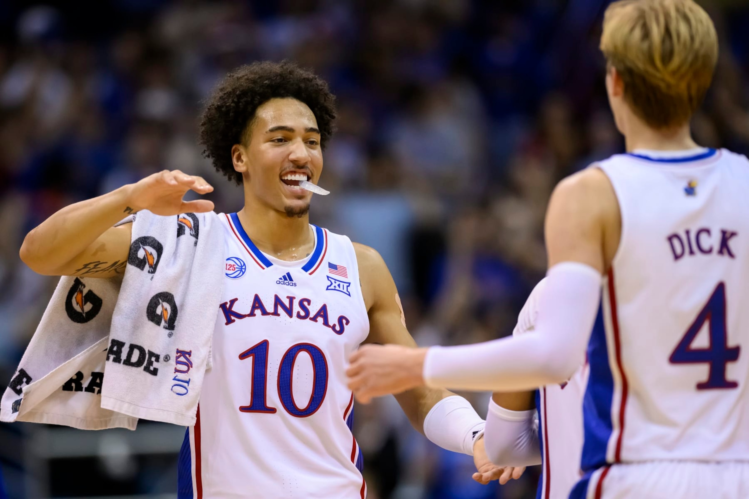 Kansas forward Jalen Wilson (10) celebrates with teammate Gradey Dick (4) during a timeout late in their NCAA college basketball game against Omaha in Lawrence, Kan., Monday, Nov. 7, 2022. (AP Photo/Reed Hoffmann) Kansas forward Jalen Wilson (10) celebrates with teammate Gradey Dick (4) during a timeout late in their NCAA college basketball game against Omaha in Lawrence, Kan., Monday, Nov. 7, 2022. (AP Photo/Reed Hoffmann)