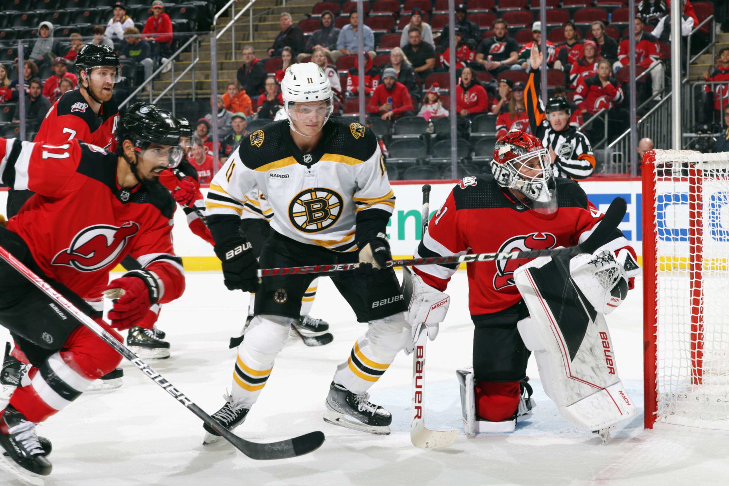 NEWARK, NEW JERSEY - OCTOBER 03: Trent Frederic #11 of the Boston Bruins skates against the New Jersey Devils at Prudential Center on October 03, 2022 in Newark, New Jersey. (Photo by Bruce Bennett/Getty Images)