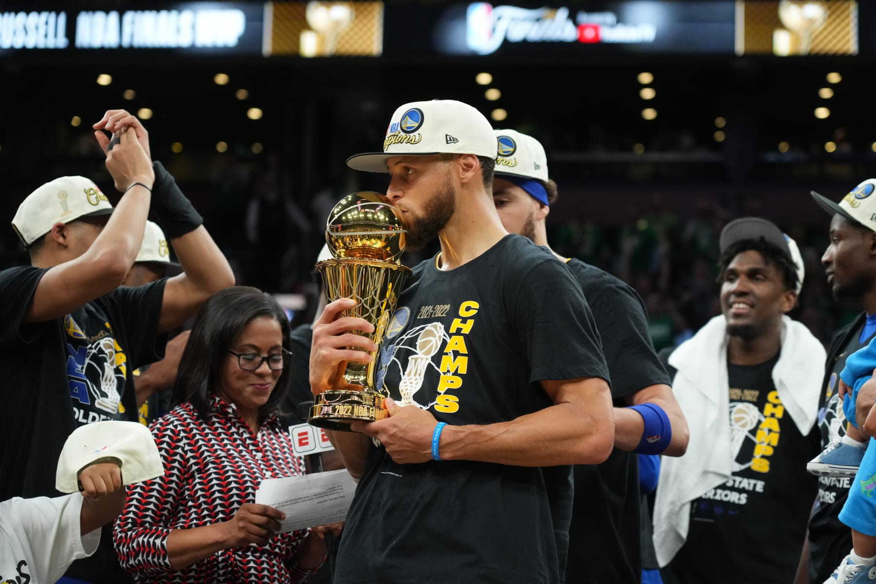BOSTON, MA - JUNE 16: Stephen Curry #30 of the Golden State Warriors celebrates on stage with the Bill Russell Finals MVP Trophy after winning during Game Six of the 2022 NBA Finals on June 16, 2022 at TD Garden in Boston, Massachusetts. NOTE TO USER: User expressly acknowledges and agrees that, by downloading and or using this photograph, user is consenting to the terms and conditions of Getty Images License Agreement. Mandatory Copyright Notice: Copyright 2022 NBAE (Photo by Jesse D. Garrabrant/NBAE via Getty Images)