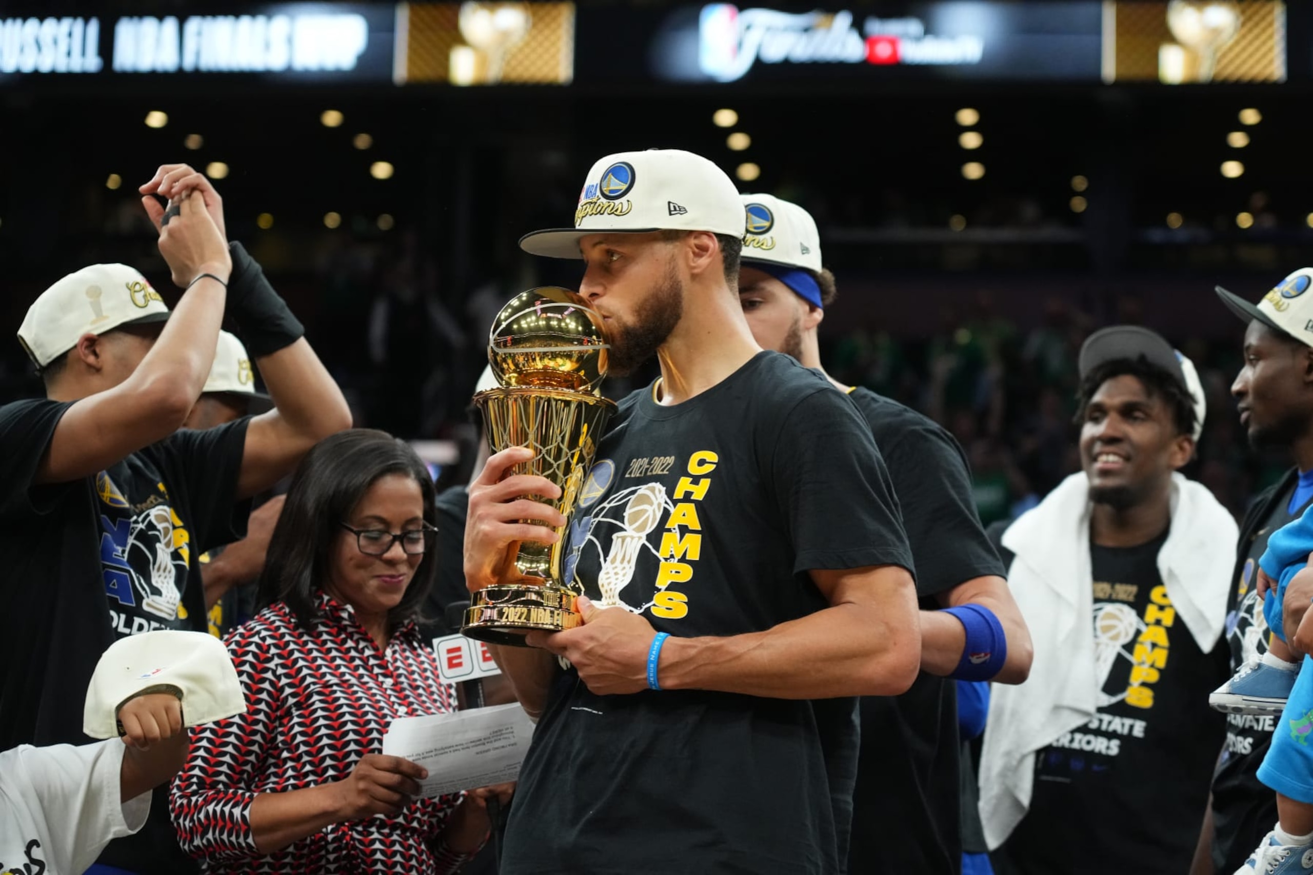 BOSTON, MA - JUNE 16: Stephen Curry #30 of the Golden State Warriors celebrates on stage with the Bill Russell Finals MVP Trophy after winning during Game Six of the 2022 NBA Finals on June 16, 2022 at TD Garden in Boston, Massachusetts. NOTE TO USER: User expressly acknowledges and agrees that, by downloading and or using this photograph, user is consenting to the terms and conditions of Getty Images License Agreement. Mandatory Copyright Notice: Copyright 2022 NBAE (Photo by Jesse D. Garrabrant/NBAE via Getty Images)