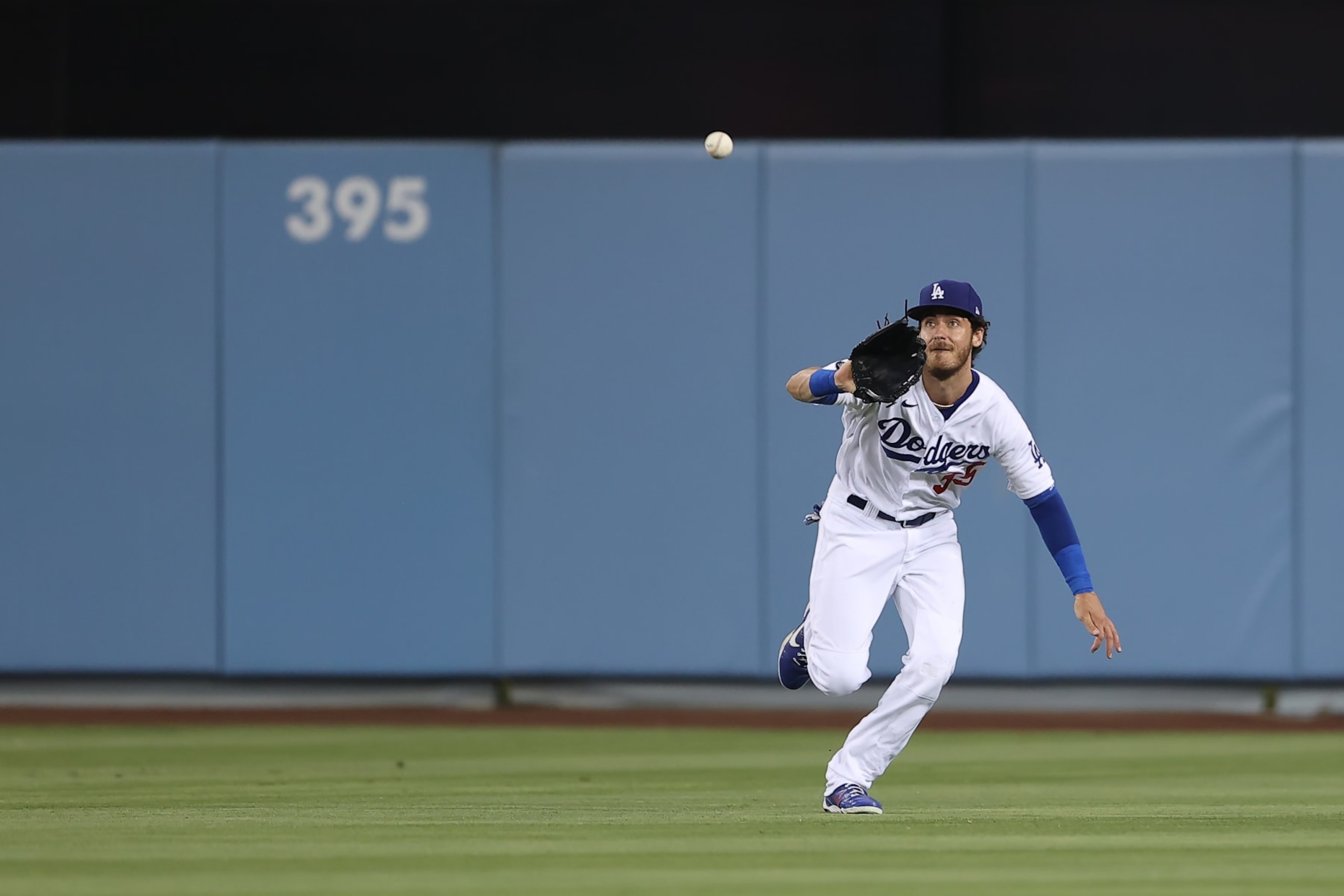 LOS ANGELES, CA - JUNE 28: Los Angeles Dodgers center fielder Cody Bellinger (35) makes a running catch in center field during the game between the San Francisco Giants and the Los Angeles Dodgers on June 28, 2021, at Dodger Stadium in Los Angeles, CA. (Photo by Peter Joneleit/Icon Sportswire via Getty Images)