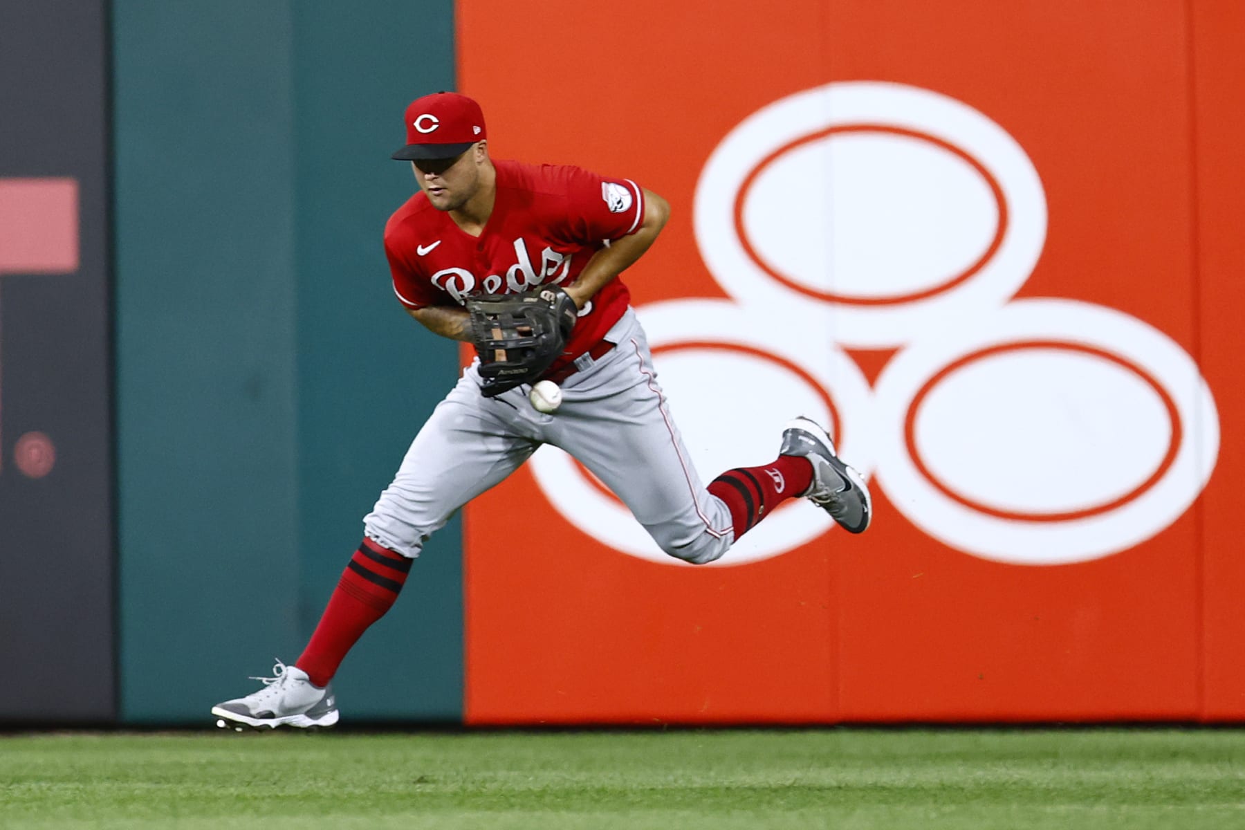 PHILADELPHIA, PA - AUGUST 24: Centerfielder Nick Senzel #15 of the Cincinnati Reds can't make a catch on a ball hit by Nick Castellanos #8 of the Philadelphia Phillies for s single during the sixth inning of a game at Citizens Bank Park on August 24, 2022 in Philadelphia, Pennsylvania. The Phillies defeated the Reds 7-5. (Photo by Rich Schultz/Getty Images)