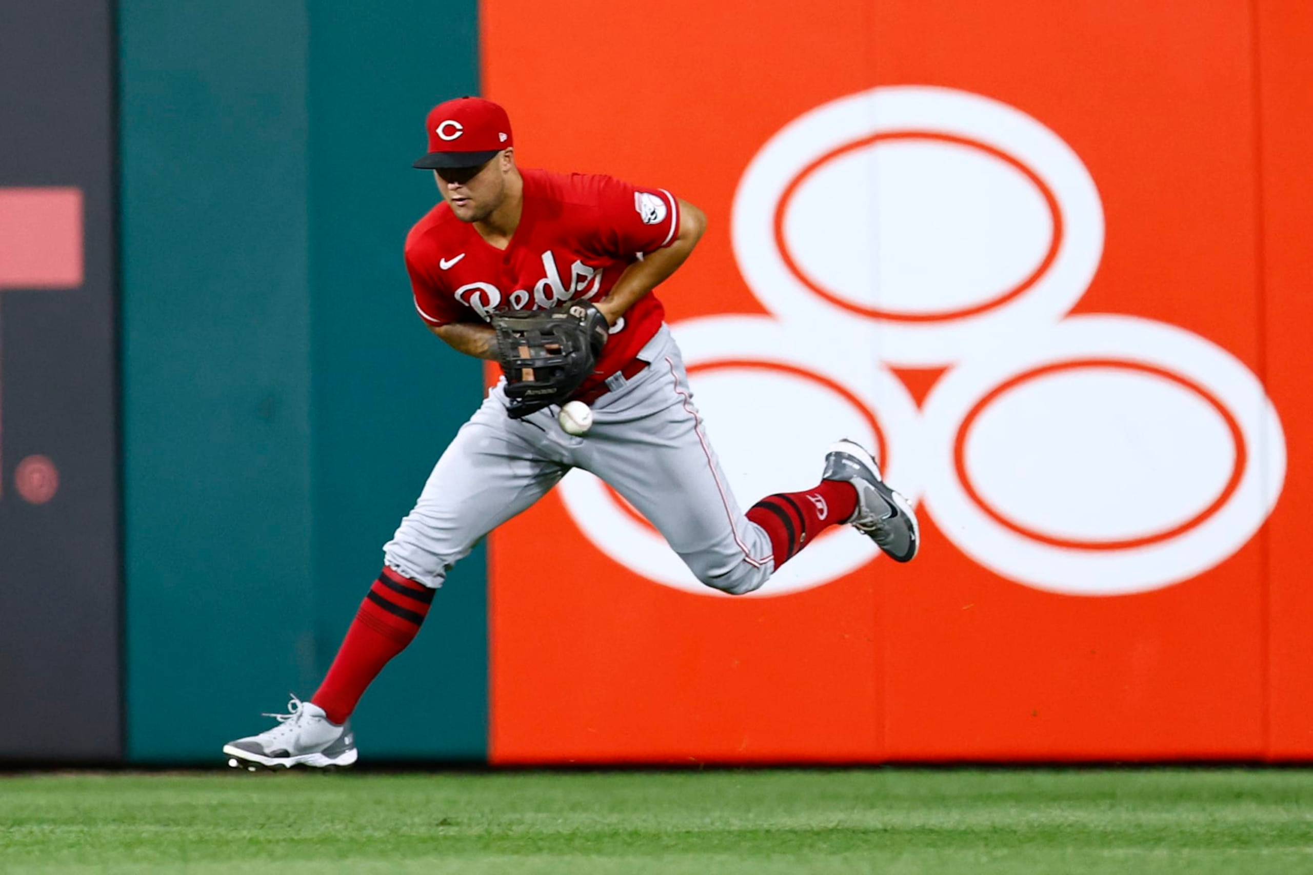 PHILADELPHIA, PA - AUGUST 24: Centerfielder Nick Senzel #15 of the Cincinnati Reds can't make a catch on a ball hit by Nick Castellanos #8 of the Philadelphia Phillies for s single during the sixth inning of a game at Citizens Bank Park on August 24, 2022 in Philadelphia, Pennsylvania. The Phillies defeated the Reds 7-5. (Photo by Rich Schultz/Getty Images)