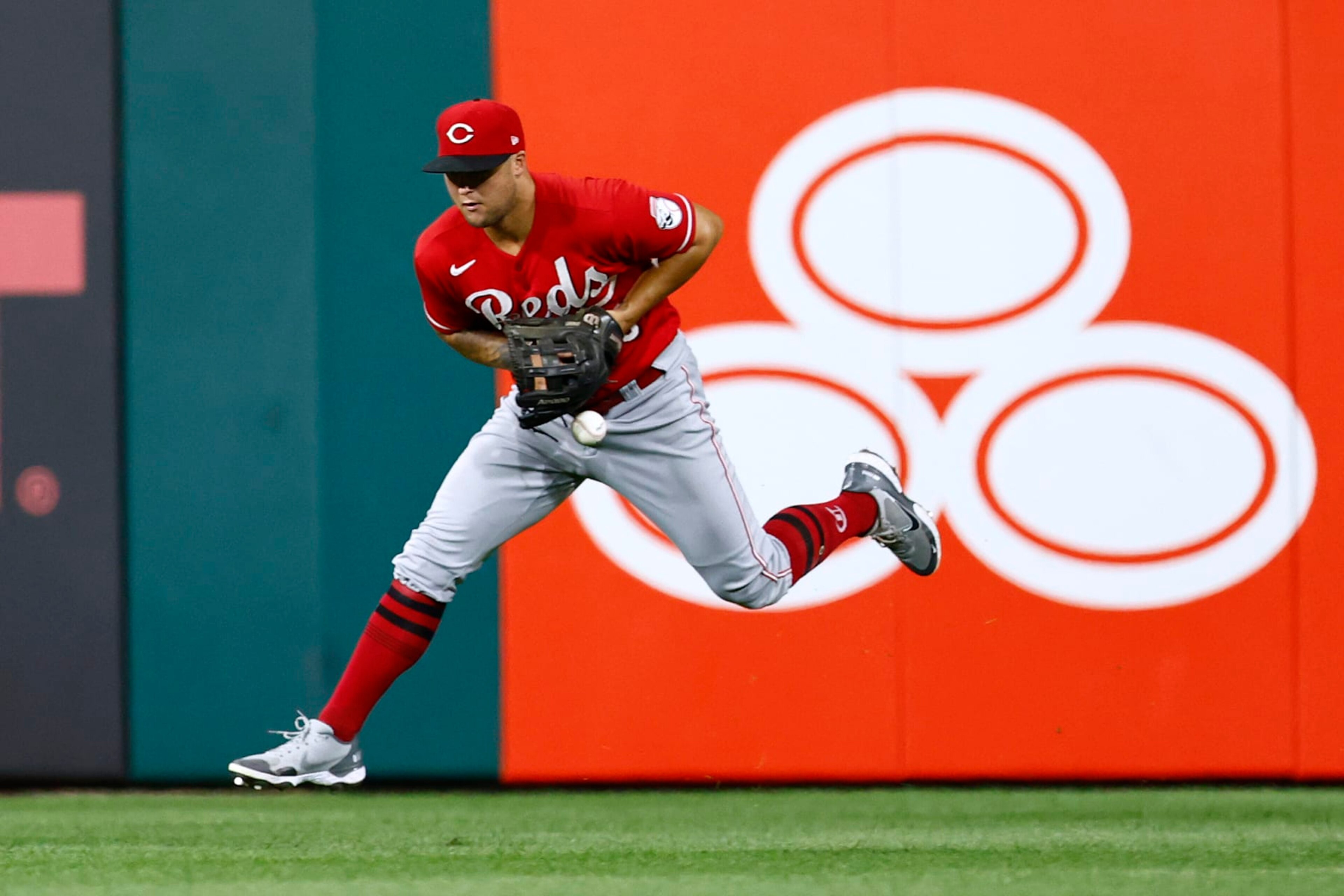 PHILADELPHIA, PA - AUGUST 24: Centerfielder Nick Senzel #15 of the Cincinnati Reds can't make a catch on a ball hit by Nick Castellanos #8 of the Philadelphia Phillies for s single during the sixth inning of a game at Citizens Bank Park on August 24, 2022 in Philadelphia, Pennsylvania. The Phillies defeated the Reds 7-5. (Photo by Rich Schultz/Getty Images)