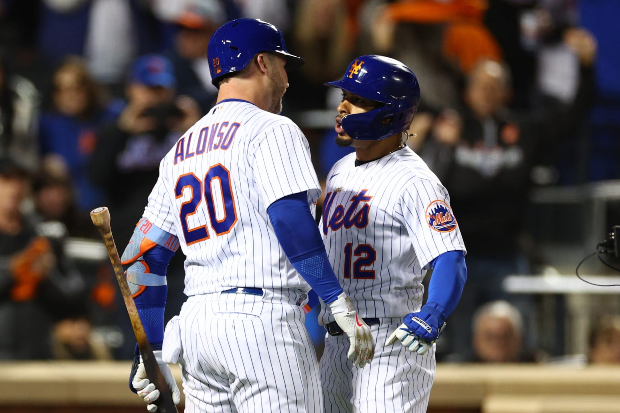 NEW YORK, NEW YORK - OCTOBER 08: Francisco Lindor #12 of the New York Mets celebrates a solo home run with Pete Alonso #20 during the first inning against the San Diego Padres in game two of the Wild Card Series at Citi Field on October 08, 2022 in New York City. (Photo by Elsa/Getty Images)