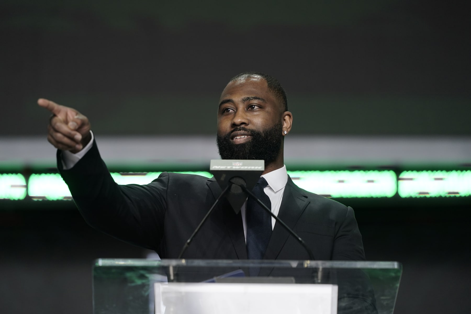 Darrelle Revis announces Iowa state running back Breece Hall as the New York Jets selection during the second round of the NFL football draft Friday, April 29, 2022, in Las Vegas. (AP Photo/Jae C. Hong)