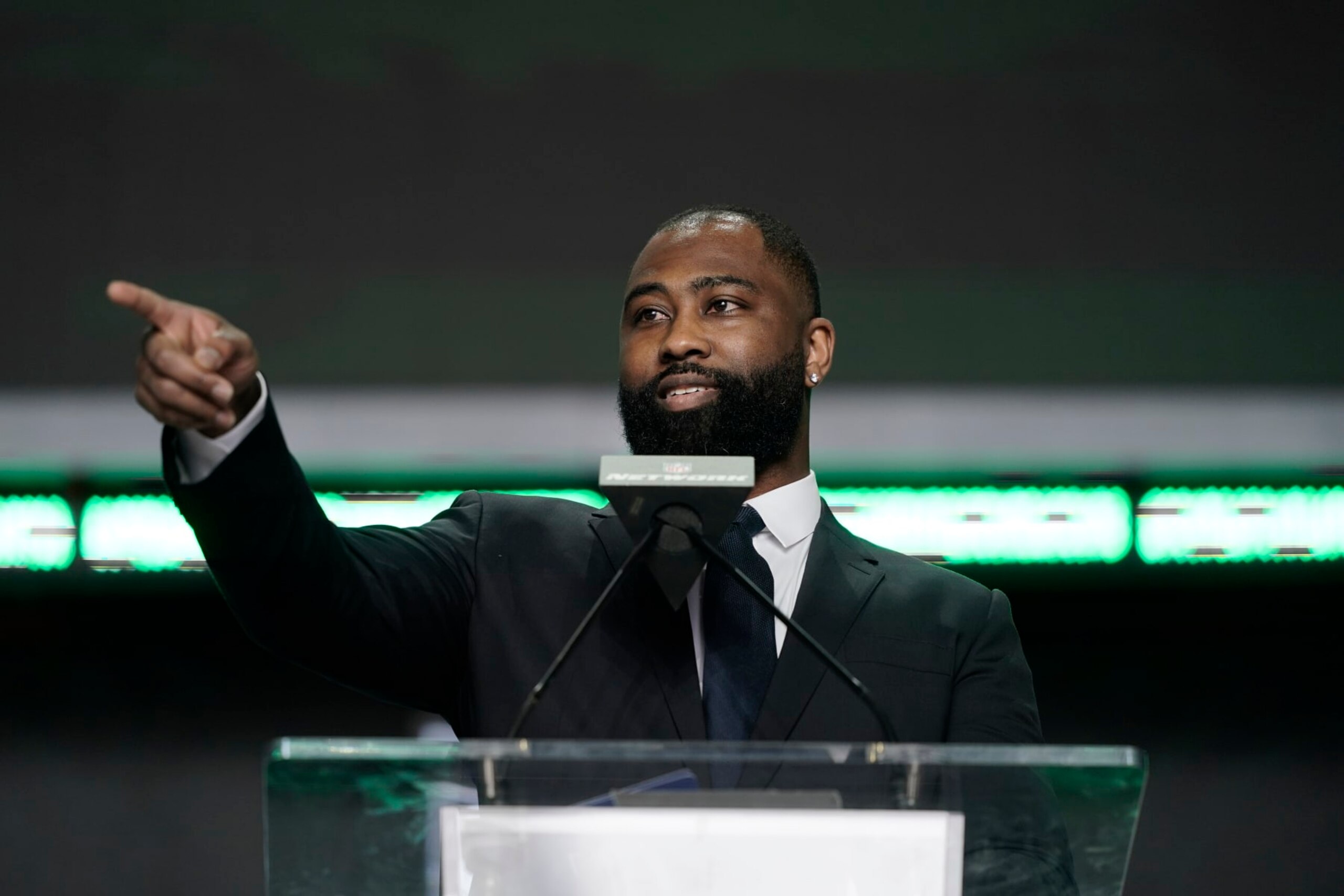 Darrelle Revis announces Iowa state running back Breece Hall as the New York Jets selection during the second round of the NFL football draft Friday, April 29, 2022, in Las Vegas. (AP Photo/Jae C. Hong)