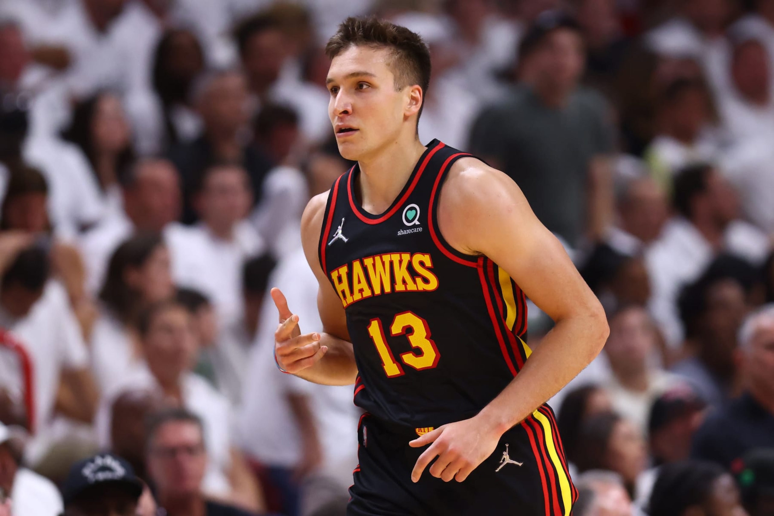 MIAMI, FLORIDA - APRIL 19: Bogdan Bogdanovic #13 of the Atlanta Hawks celebrates a three pointer against the Miami Heat during the second half in Game Two of the Eastern Conference First Round at FTX Arena on April 19, 2022 in Miami, Florida. NOTE TO USER: User expressly acknowledges and agrees that, by downloading and or using this photograph, User is consenting to the terms and conditions of the Getty Images License Agreement.  (Photo by Michael Reaves/Getty Images)