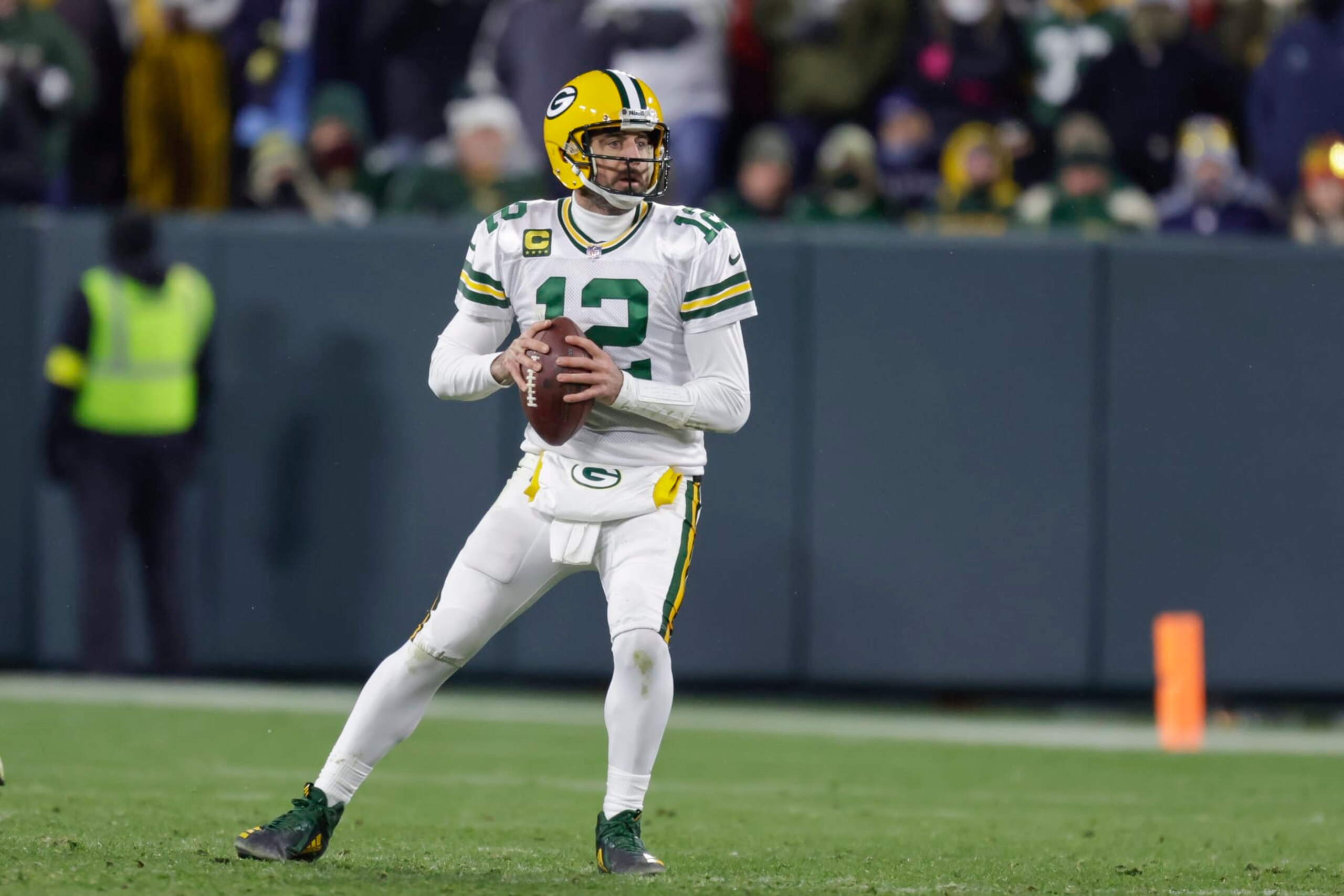 Green Bay Packers quarterback Aaron Rodgers (12) looks to pass against the Tennessee Titans during an NFL football game Thursday, Nov. 17, 2022, in Green Bay, Wis. (AP Photo/Matt Ludtke)