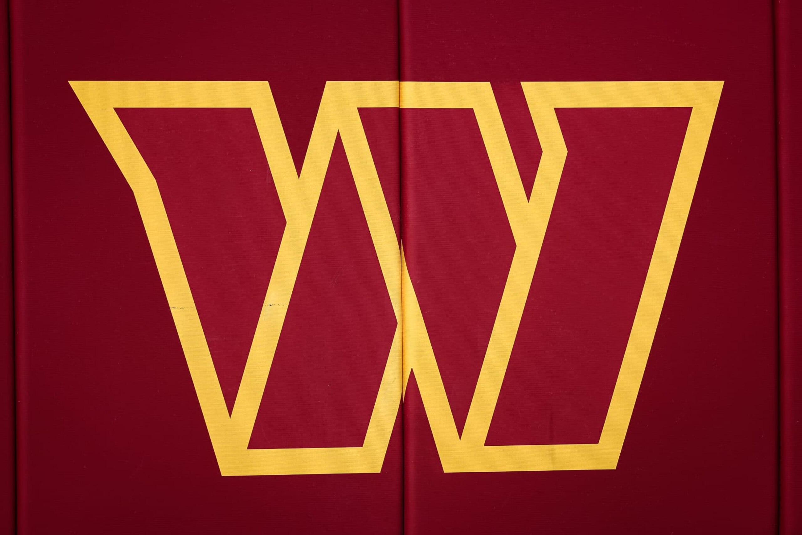 LANDOVER, MD - AUGUST 13: A view of the Washington Commanders logo in the stadium before the preseason game between the Washington Commanders and the Carolina Panthers at FedExField on August 13, 2022 in Landover, Maryland. (Photo by Scott Taetsch/Getty Images)