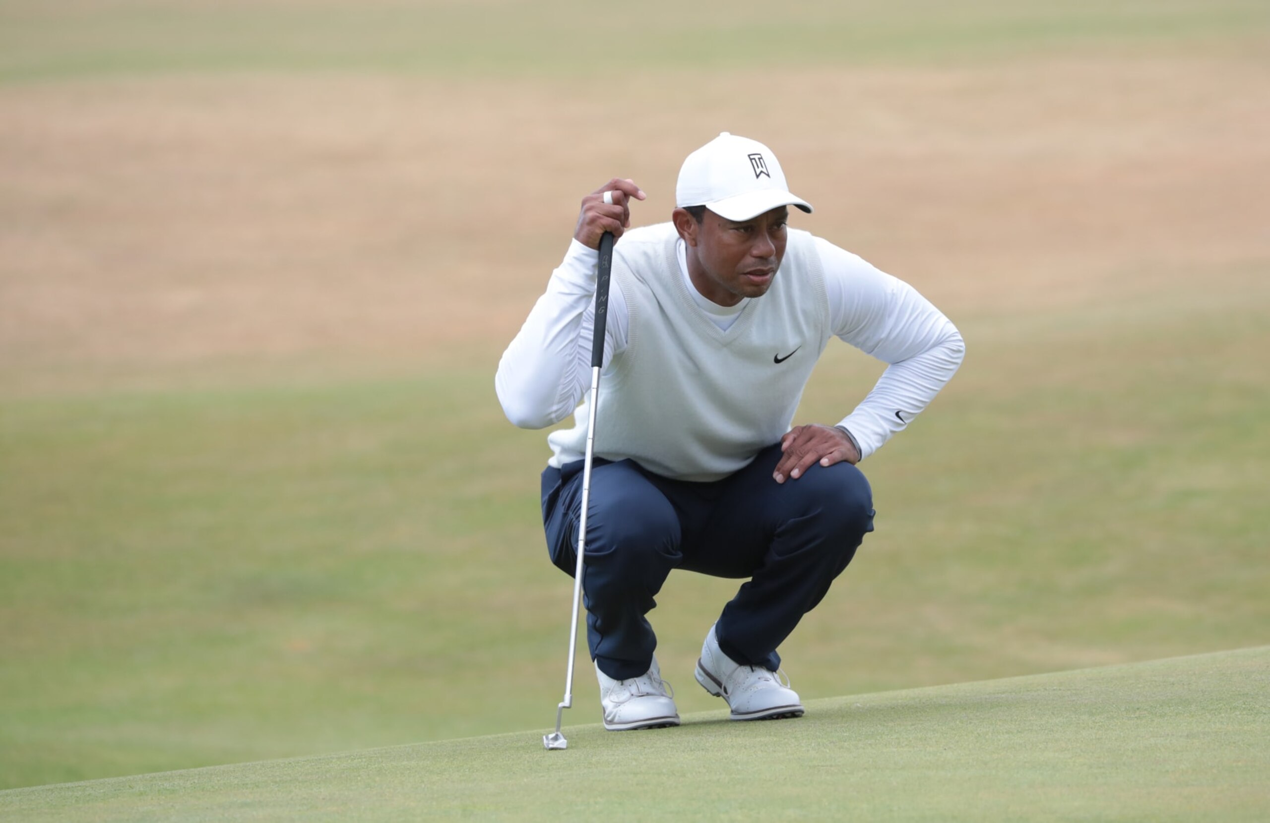 ST ANDREWS, SCOTLAND - JULY 15: Tiger Woods prepares a shot during Day Two of The 150th Open at St Andrews Old Course on July 15, 2022 in St Andrews, United Kingdom. (Photo by MB Media/Getty Images) ST ANDREWS, SCOTLAND - JULY 15: Tiger Woods prepares a shot during Day Two of The 150th Open at St Andrews Old Course on July 15, 2022 in St Andrews, United Kingdom. (Photo by MB Media/Getty Images)