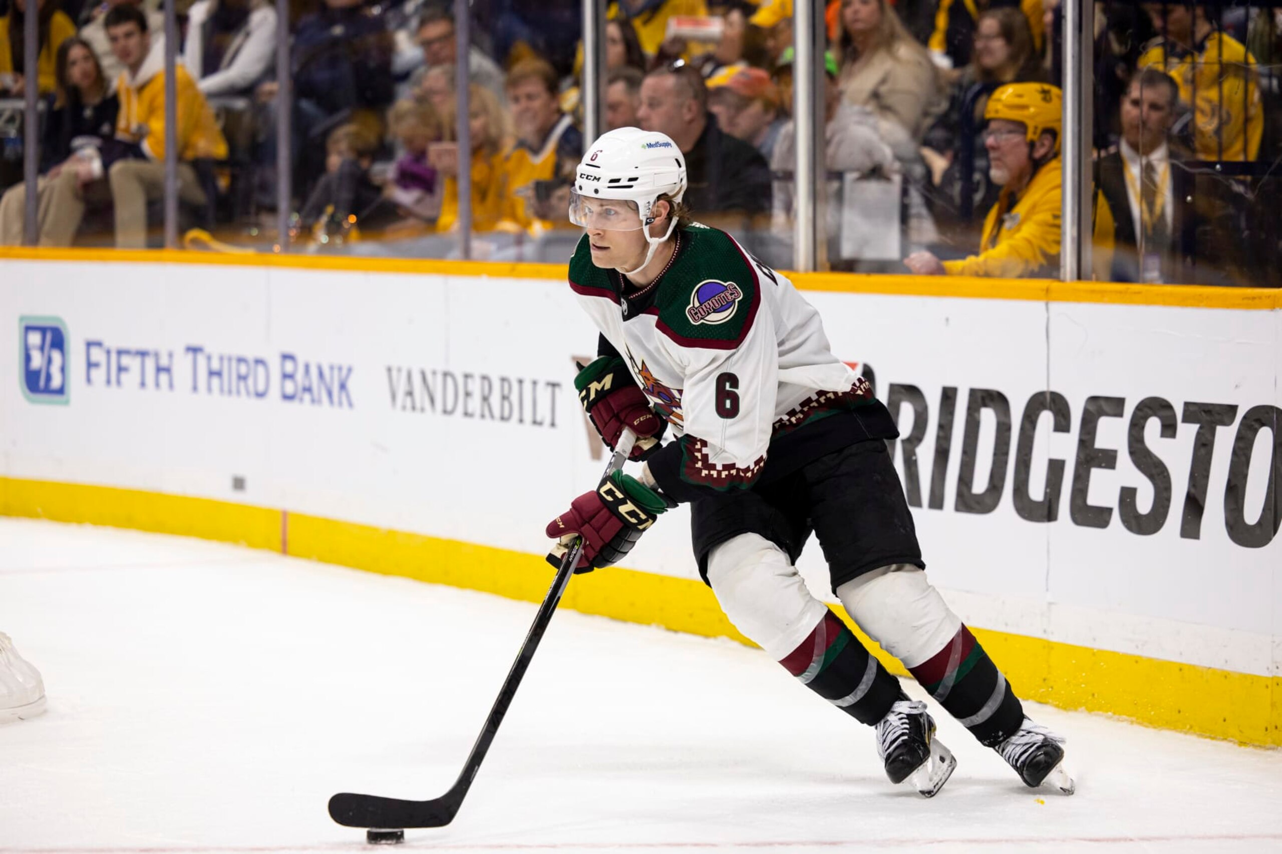 NASHVILLE, TN - NOVEMBER 21:  Jakob Chychrun #6 of the Arizona Coyotes skates the puck against the Nashville Predators during the third period at Bridgestone Arena on November 21, 2022 in Nashville, Tennessee. (Photo by Brett Carlsen/Getty Images)