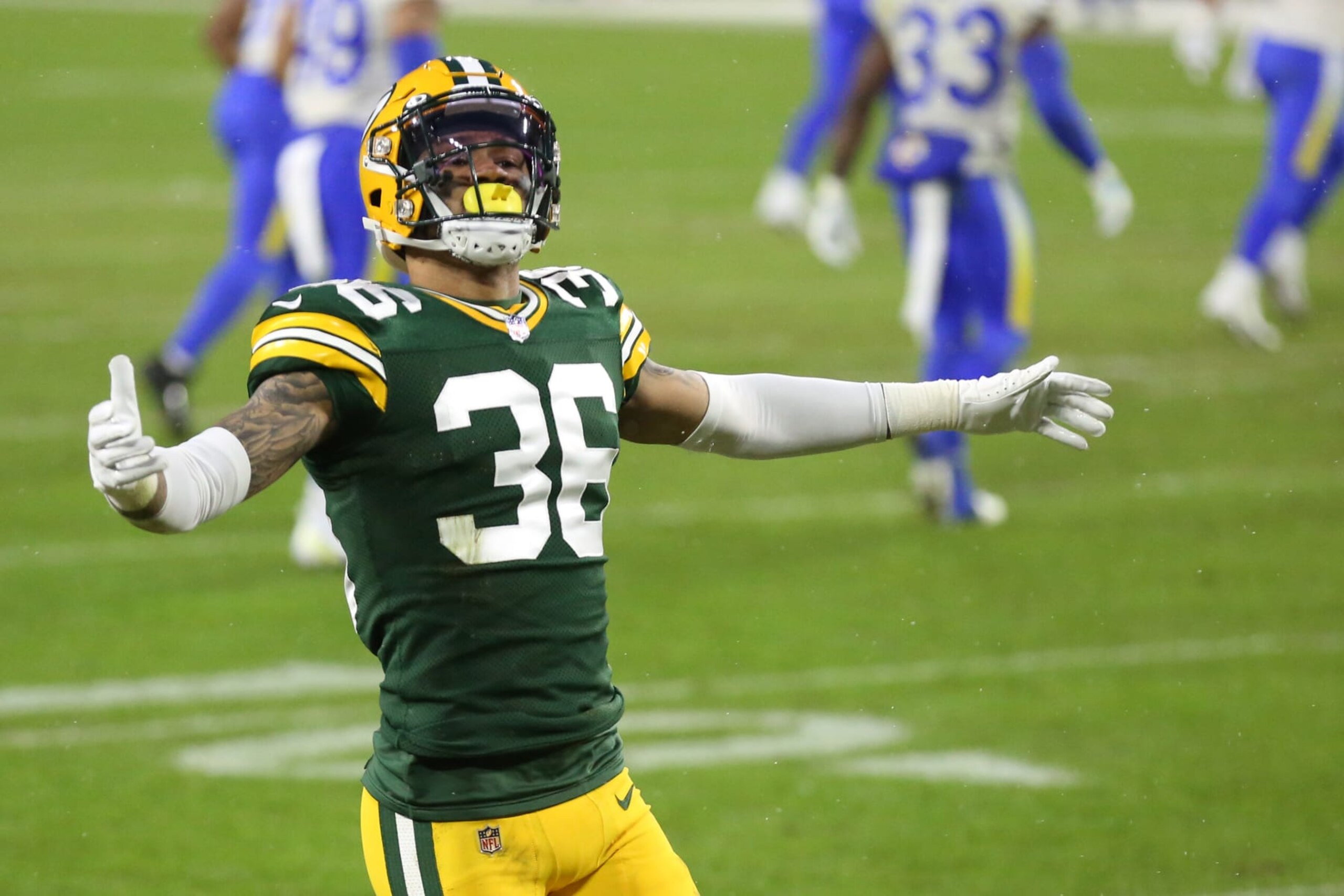 GREEN BAY, WI - JANUARY 16: Green Bay Packers defensive back Vernon Scott (36) pumps up the crowd during a NFL Divisional Playoff game between the Green Bay Packers and the Los Angeles Rams at Lambeau Field on January 16, 2021 in Green Bay, WI. (Photo by Larry Radloff/Icon Sportswire via Getty Images)