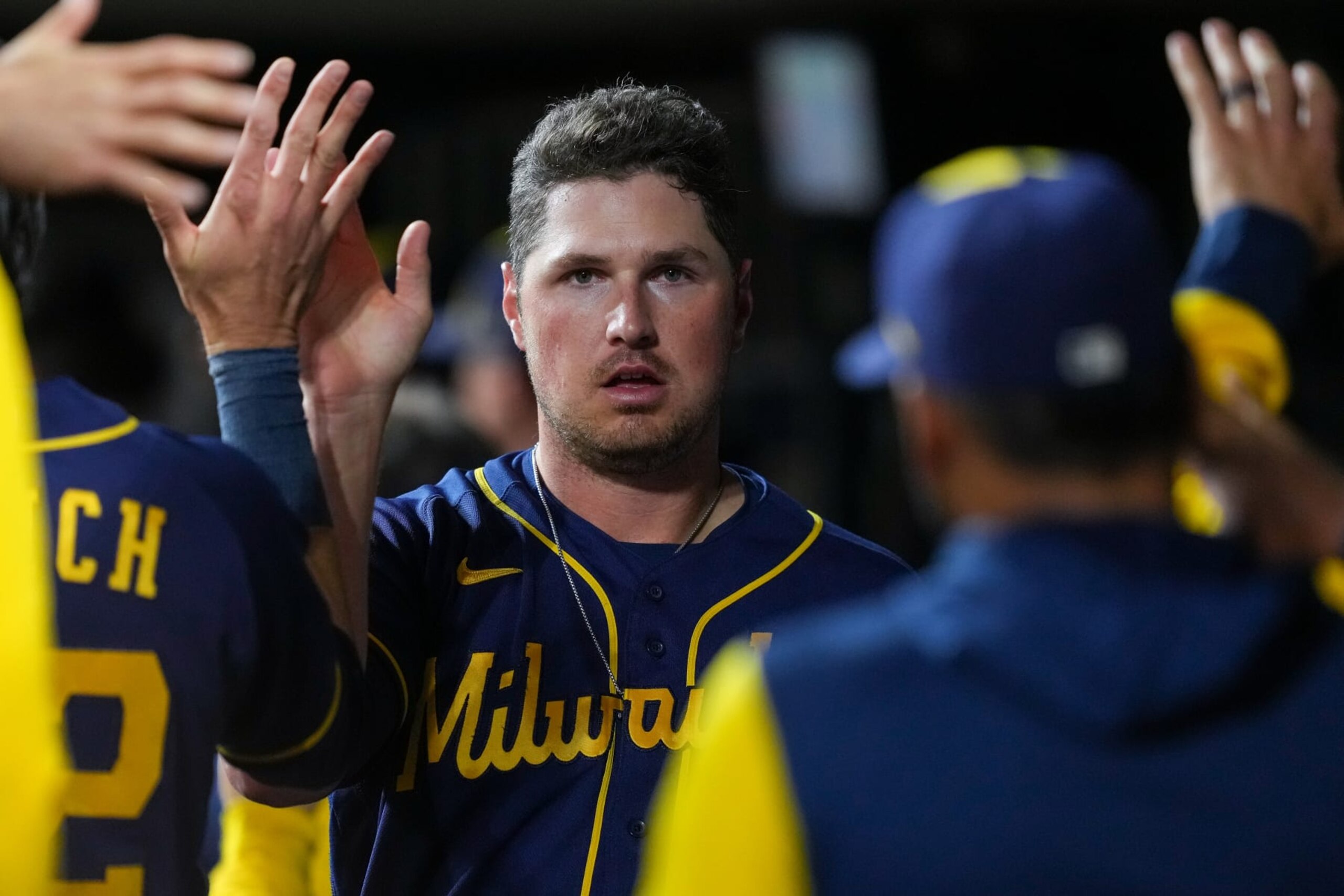 CINCINNATI, OHIO - SEPTEMBER 23: Hunter Renfroe #12 of the Milwaukee Brewers celebrates with teammates after scoring a run in the seventh inning against the Cincinnati Reds at Great American Ball Park on September 23, 2022 in Cincinnati, Ohio. (Photo by Dylan Buell/Getty Images) CINCINNATI, OHIO - SEPTEMBER 23: Hunter Renfroe #12 of the Milwaukee Brewers celebrates with teammates after scoring a run in the seventh inning against the Cincinnati Reds at Great American Ball Park on September 23, 2022 in Cincinnati, Ohio. (Photo by Dylan Buell/Getty Images)
