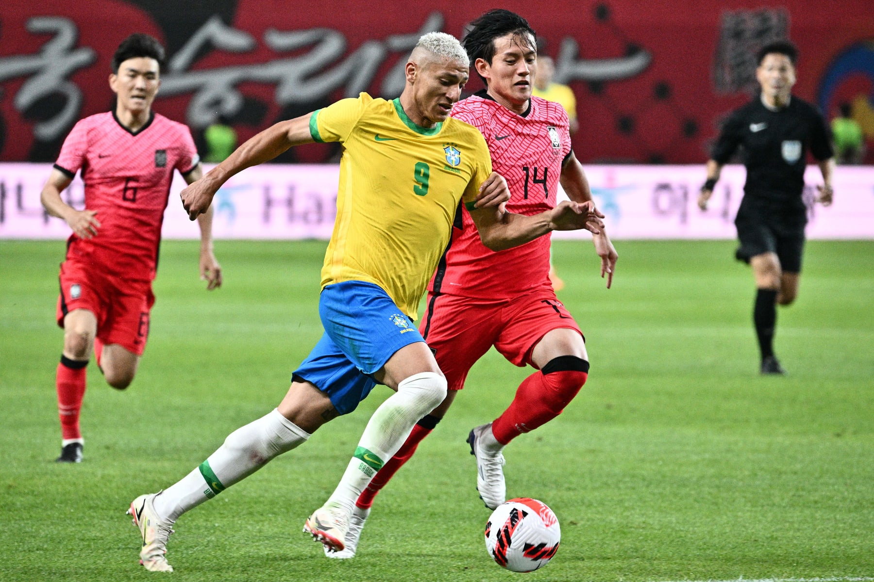 Brazil's Richarlison (front L) vies for the ball against South Korea's Hong Chul at Seoul World Cup Stadium in Seoul on June 2, 2022, during a friendly football match between South Korea and Brazil. (Photo by ANTHONY WALLACE / AFP) (Photo by ANTHONY WALLACE/AFP via Getty Images)