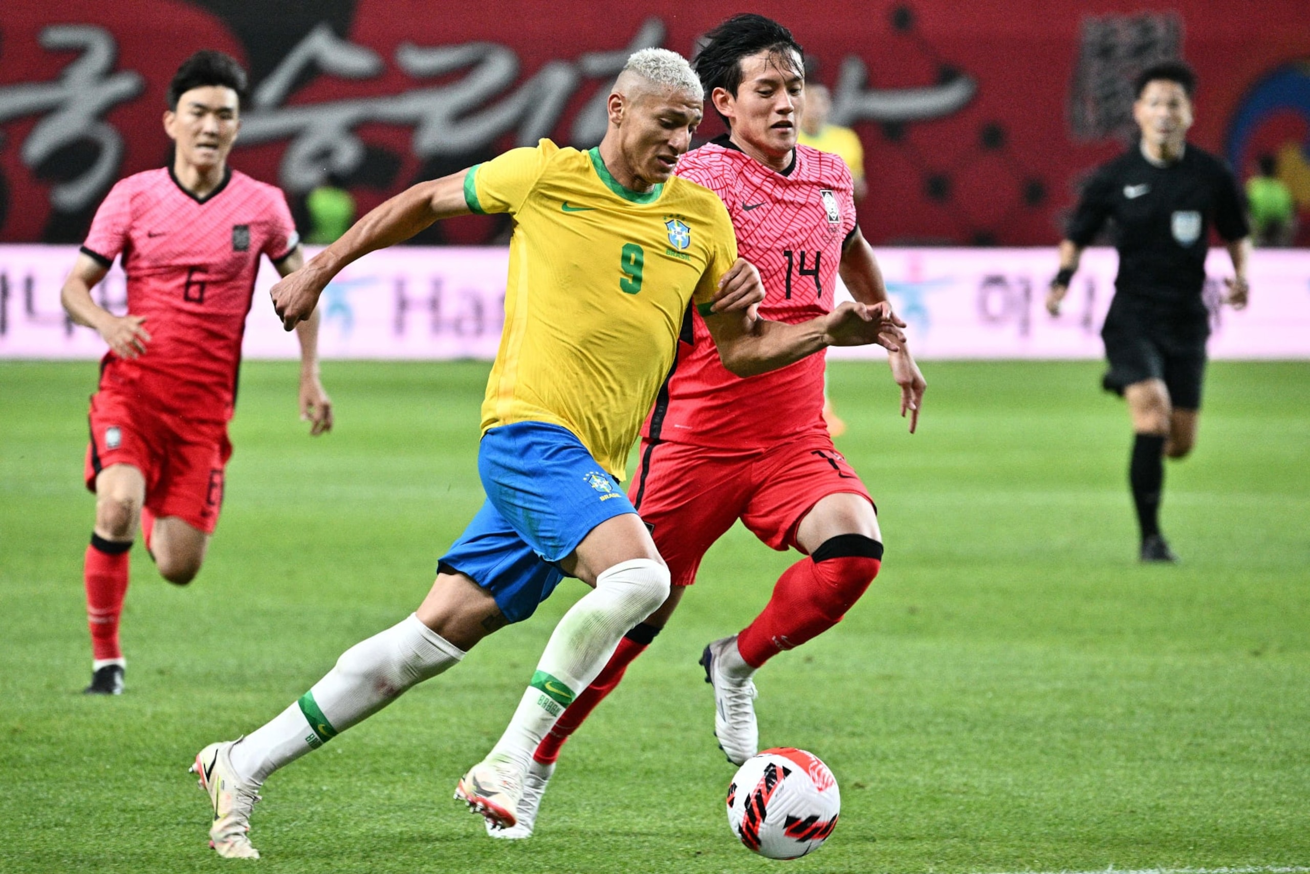 Brazil's Richarlison (front L) vies for the ball against South Korea's Hong Chul at Seoul World Cup Stadium in Seoul on June 2, 2022, during a friendly football match between South Korea and Brazil. (Photo by ANTHONY WALLACE / AFP) (Photo by ANTHONY WALLACE/AFP via Getty Images)