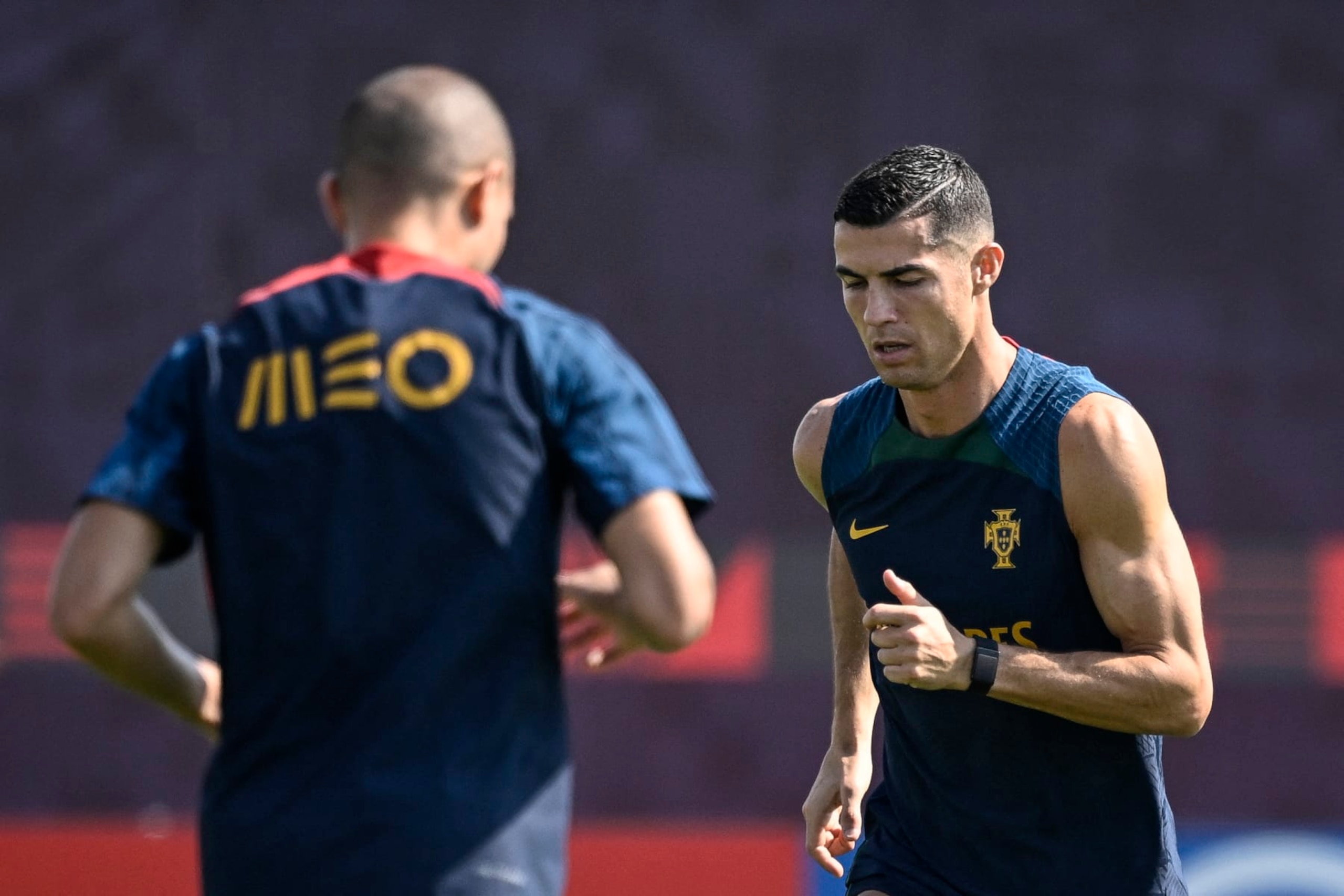 Unknown Portugal's forward Cristiano Ronaldo (R) takes part in a training session at the Al Shahaniya SC training site in Al Samriya, northwest of Doha, on November 22, 2022, during the Qatar 2022 World Cup football tournament. (Photo by PATRICIA DE MELO MOREIRA / AFP) (Photo by PATRICIA DE MELO MOREIRA/AFP via Getty Images) Unknown Portugal's forward Cristiano Ronaldo (R) takes part in a training session at the Al Shahaniya SC training site in Al Samriya, northwest of Doha, on November 22, 2022, during the Qatar 2022 World Cup football tournament. (Photo by PATRICIA DE MELO MOREIRA / AFP) (Photo by PATRICIA DE MELO MOREIRA/AFP via Getty Images)