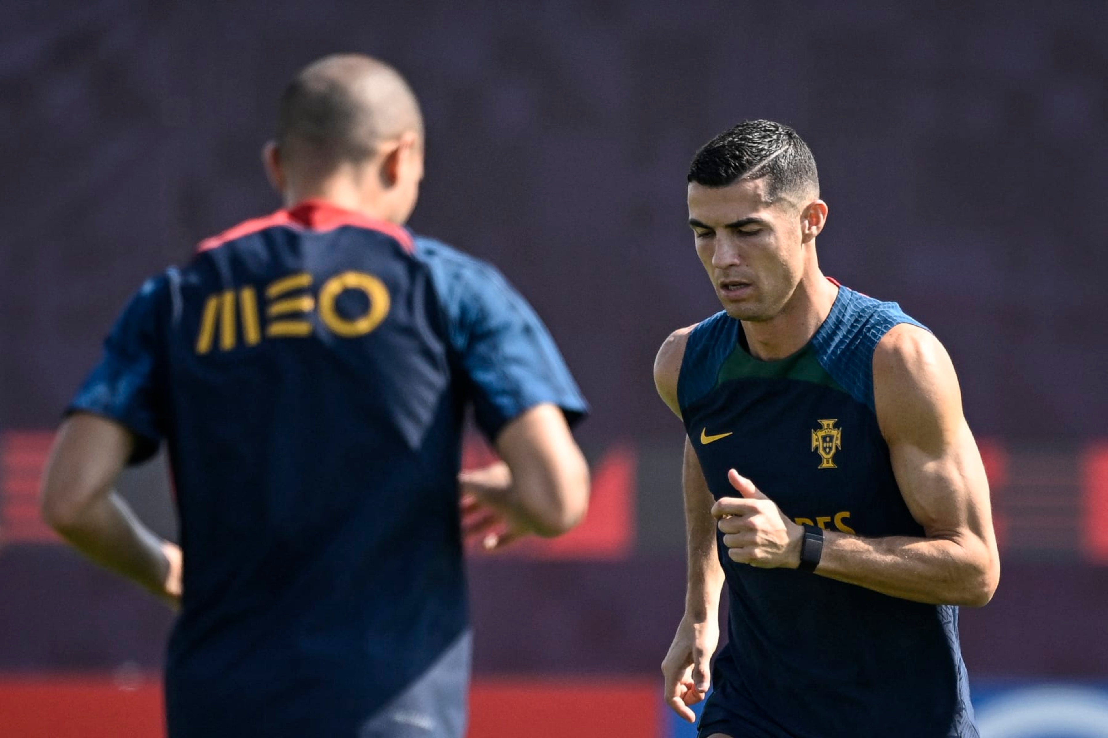 Unknown Portugal's forward Cristiano Ronaldo (R) takes part in a training session at the Al Shahaniya SC training site in Al Samriya, northwest of Doha, on November 22, 2022, during the Qatar 2022 World Cup football tournament. (Photo by PATRICIA DE MELO MOREIRA / AFP) (Photo by PATRICIA DE MELO MOREIRA/AFP via Getty Images)