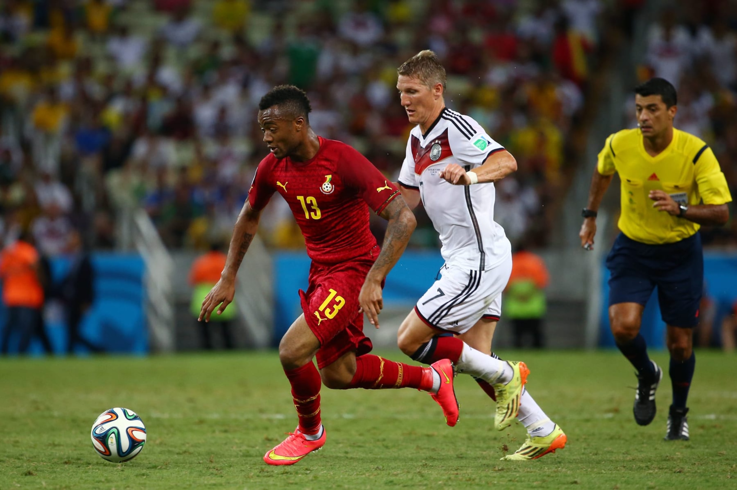 FORTALEZA, BRAZIL - JUNE 21: Jordan Ayew of Ghana controls the ball as Bastian Schweinsteiger of Germany gives chase during the 2014 FIFA World Cup Brazil Group G match between Germany and Ghana at Castelao on June 21, 2014 in Fortaleza, Brazil. (Photo by Robert Cianflone/Getty Images) FORTALEZA, BRAZIL - JUNE 21: Jordan Ayew of Ghana controls the ball as Bastian Schweinsteiger of Germany gives chase during the 2014 FIFA World Cup Brazil Group G match between Germany and Ghana at Castelao on June 21, 2014 in Fortaleza, Brazil. (Photo by Robert Cianflone/Getty Images)