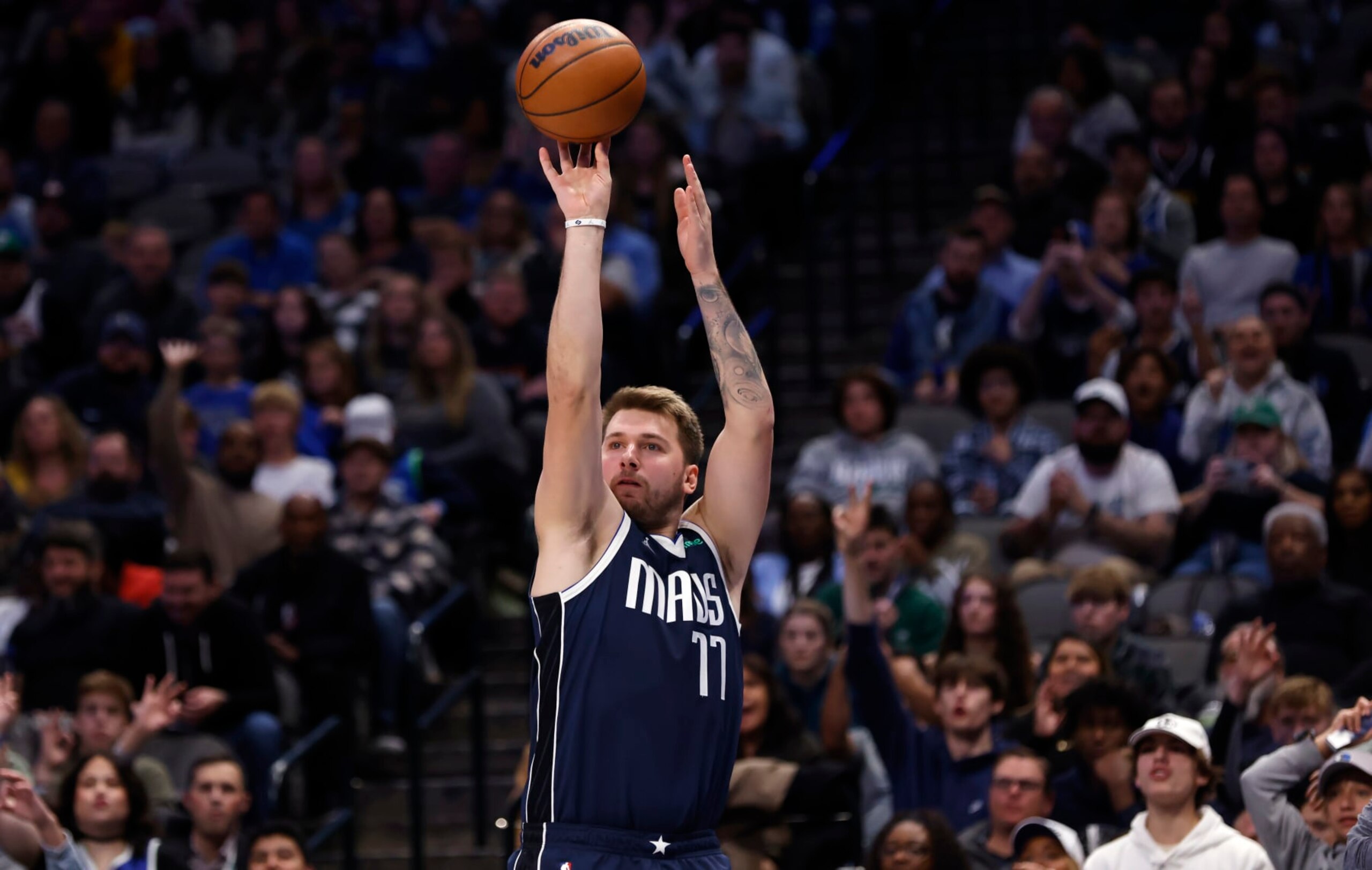 DALLAS, TX - NOVEMBER 20: Luka Doncic #77 of the Dallas Mavericks shoots the ball against the Denver Nuggets in the second half at American Airlines Center on November 20, 2022 in Dallas, Texas. The Nuggets won 98-97. NOTE TO USER: User expressly acknowledges and agrees that, by downloading and or using this photograph, User is consenting to the terms and conditions of the Getty Images License Agreement. (Photo by Ron Jenkins/Getty Images)