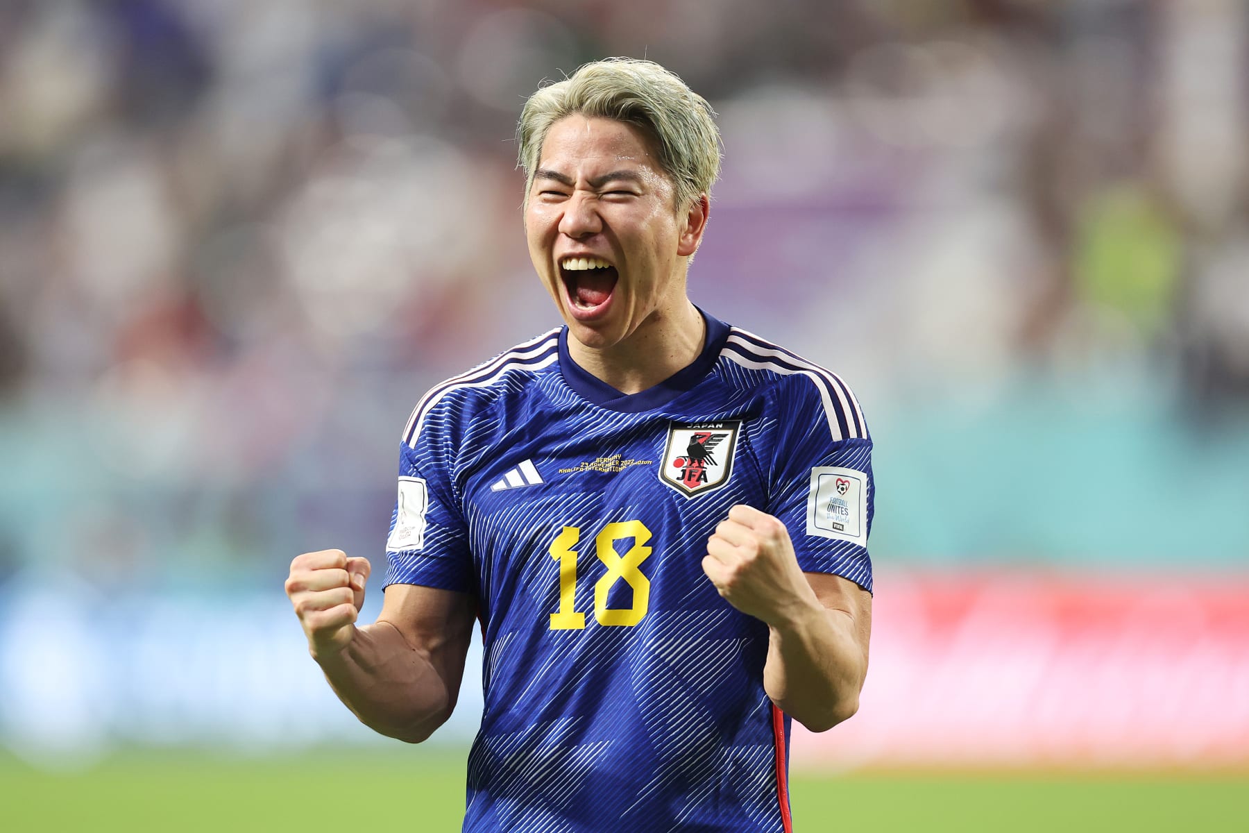 DOHA, QATAR - NOVEMBER 23: Takuma Asano of Japan celebrates following the FIFA World Cup Qatar 2022 Group E match between Germany and Japan at Khalifa International Stadium on November 23, 2022 in Doha, Qatar. (Photo by Mark Metcalfe - FIFA/FIFA via Getty Images)