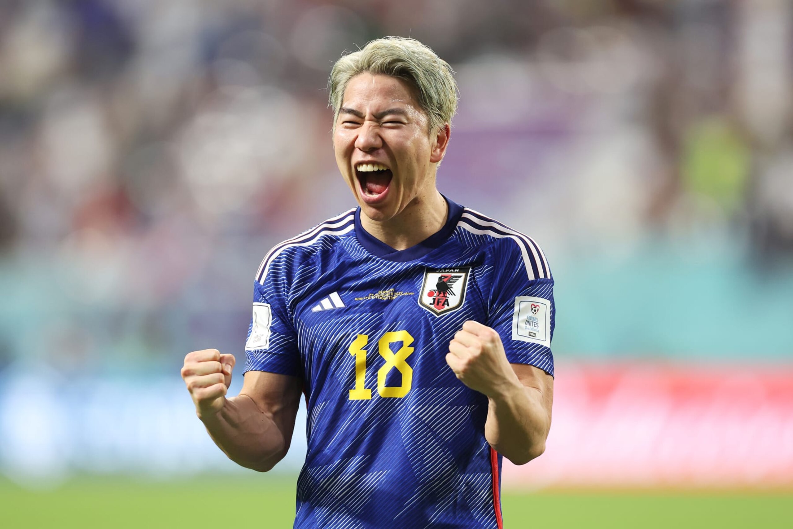 DOHA, QATAR - NOVEMBER 23: Takuma Asano of Japan celebrates following the FIFA World Cup Qatar 2022 Group E match between Germany and Japan at Khalifa International Stadium on November 23, 2022 in Doha, Qatar. (Photo by Mark Metcalfe - FIFA/FIFA via Getty Images) DOHA, QATAR - NOVEMBER 23: Takuma Asano of Japan celebrates following the FIFA World Cup Qatar 2022 Group E match between Germany and Japan at Khalifa International Stadium on November 23, 2022 in Doha, Qatar. (Photo by Mark Metcalfe - FIFA/FIFA via Getty Images)