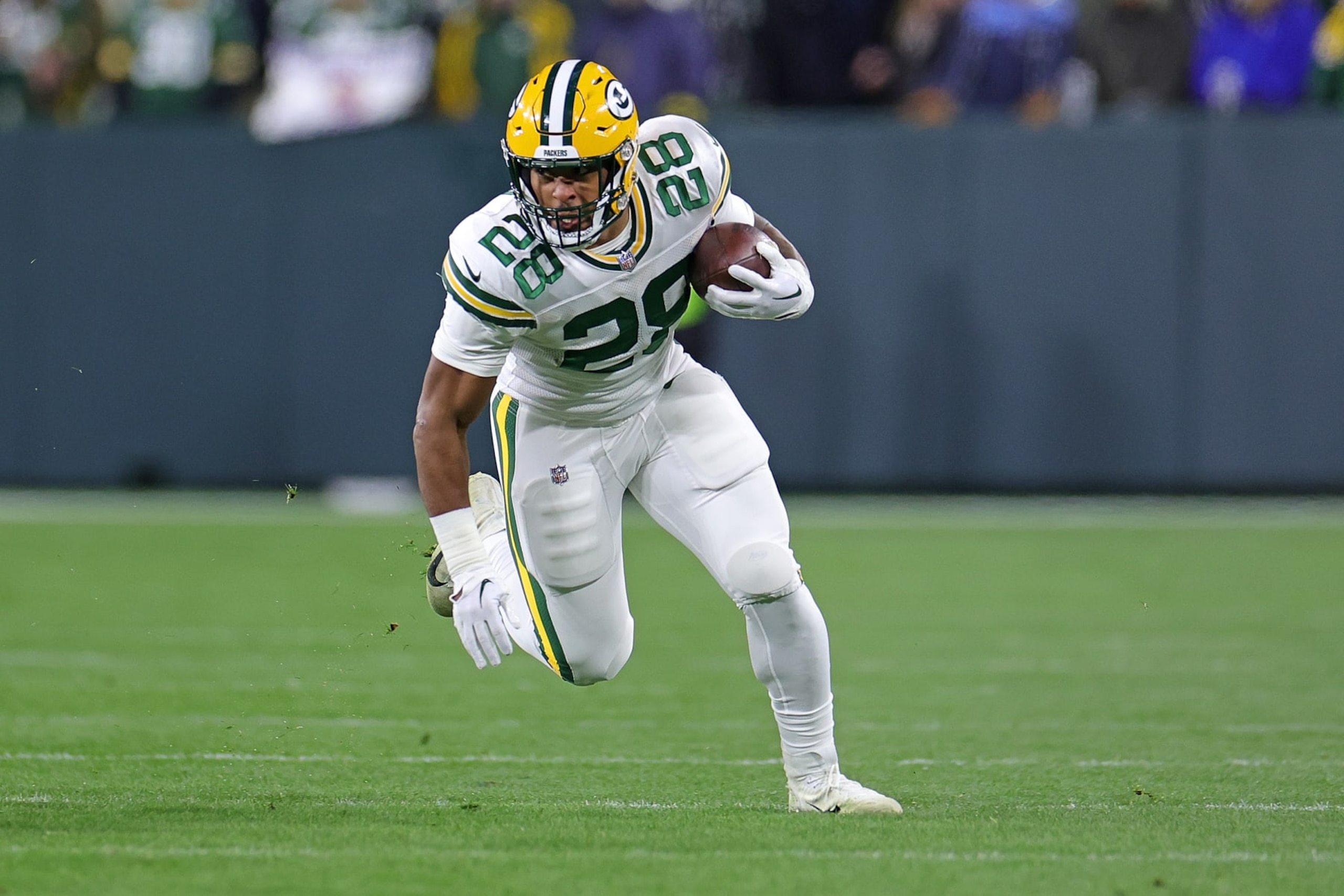GREEN BAY, WISCONSIN - NOVEMBER 17: AJ Dillon #28 of the Green Bay Packers runs for yards during a game against the Tennessee Titans at Lambeau Field on November 17, 2022 in Green Bay, Wisconsin. The Titans defeated the Packers 27-17. (Photo by Stacy Revere/Getty Images) GREEN BAY, WISCONSIN - NOVEMBER 17: AJ Dillon #28 of the Green Bay Packers runs for yards during a game against the Tennessee Titans at Lambeau Field on November 17, 2022 in Green Bay, Wisconsin. The Titans defeated the Packers 27-17. (Photo by Stacy Revere/Getty Images)