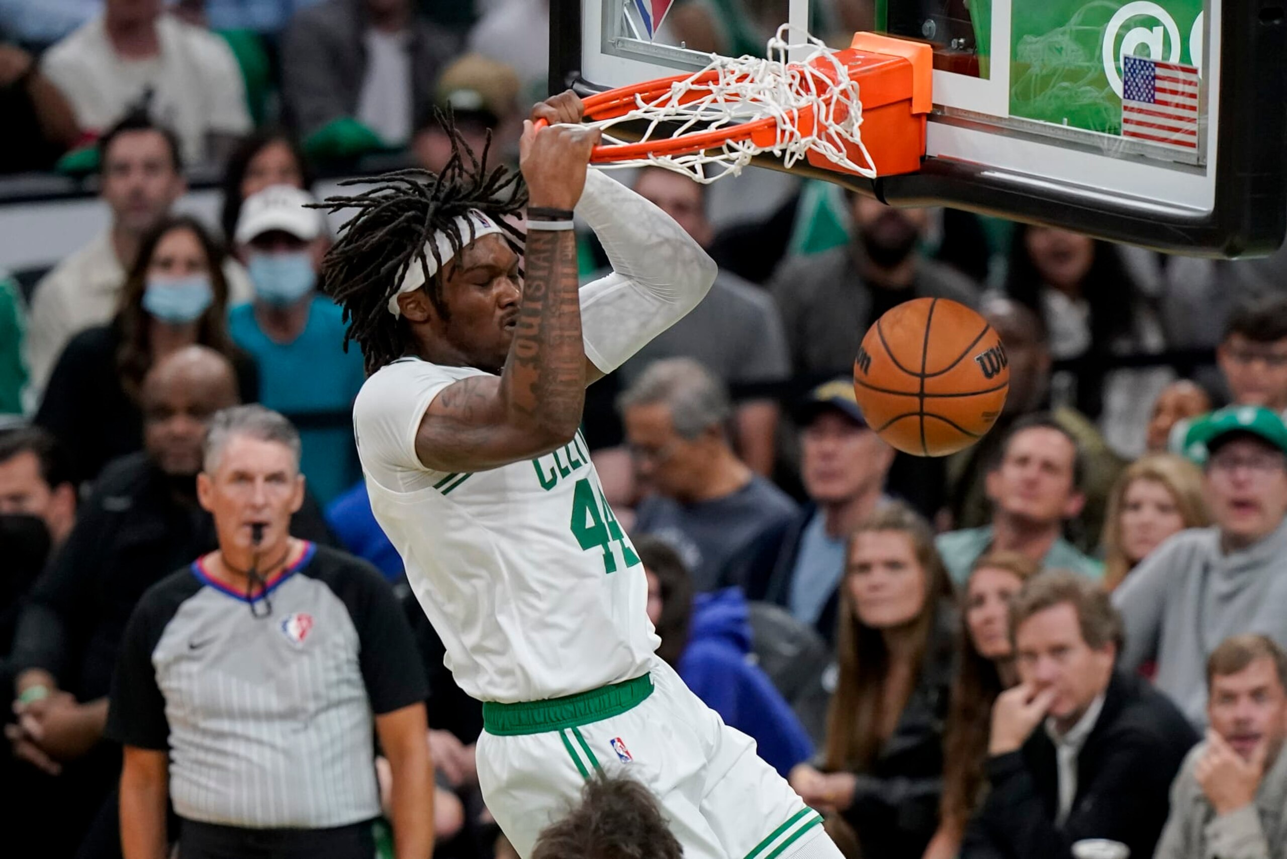 Boston Celtics center Robert Williams III (44) dunks the ball against the Golden State Warriors during the second quarter of Game 3 of basketball's NBA Finals, Wednesday, June 8, 2022, in Boston. (AP Photo/Steven Senne)