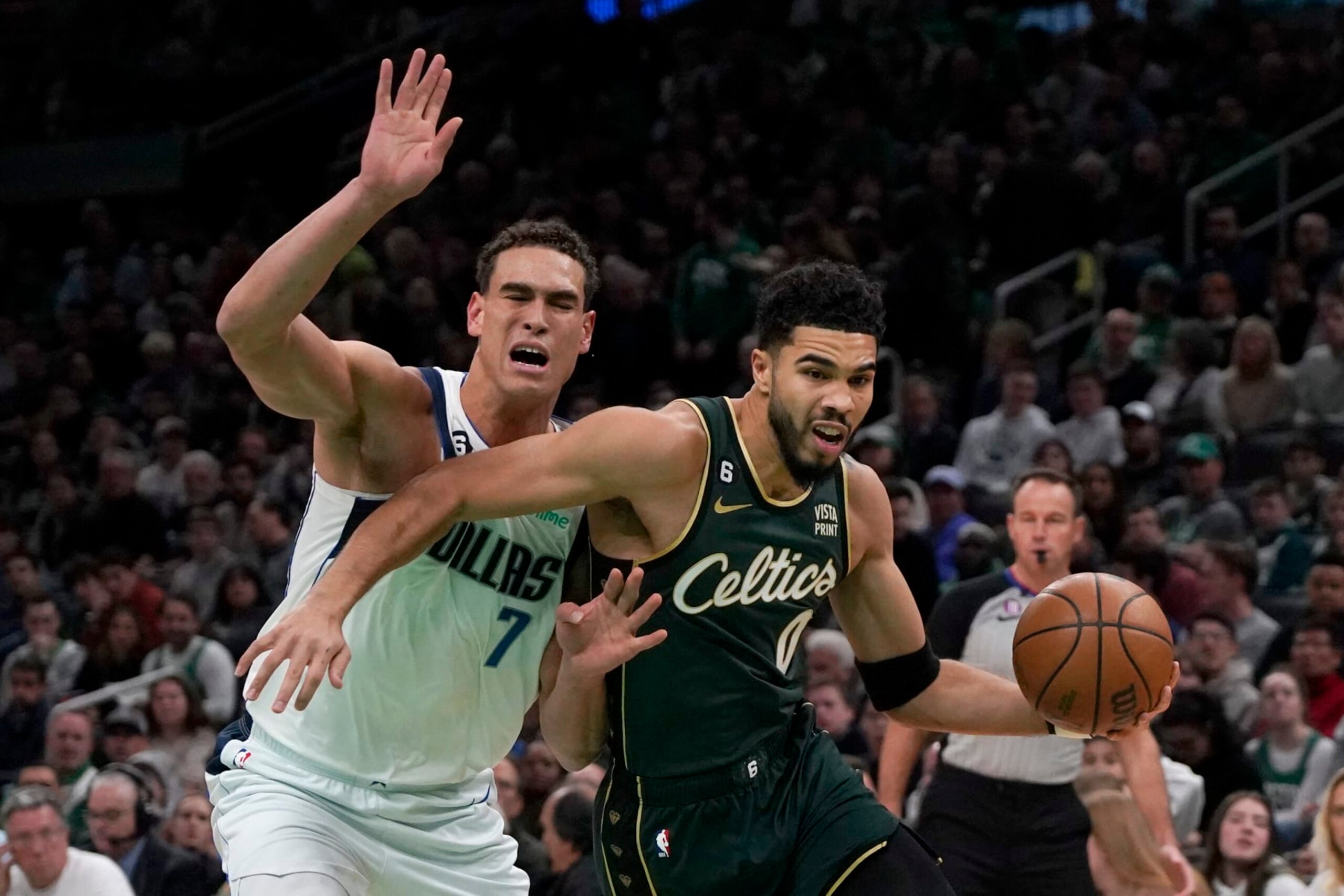 Boston Celtics forward Jayson Tatum (0) drives past Dallas Mavericks center Dwight Powell (7) during the first half of an NBA basketball game, Wednesday, Nov. 23, 2022, in Boston. (AP Photo/Mary Schwalm) Boston Celtics forward Jayson Tatum (0) drives past Dallas Mavericks center Dwight Powell (7) during the first half of an NBA basketball game, Wednesday, Nov. 23, 2022, in Boston. (AP Photo/Mary Schwalm)