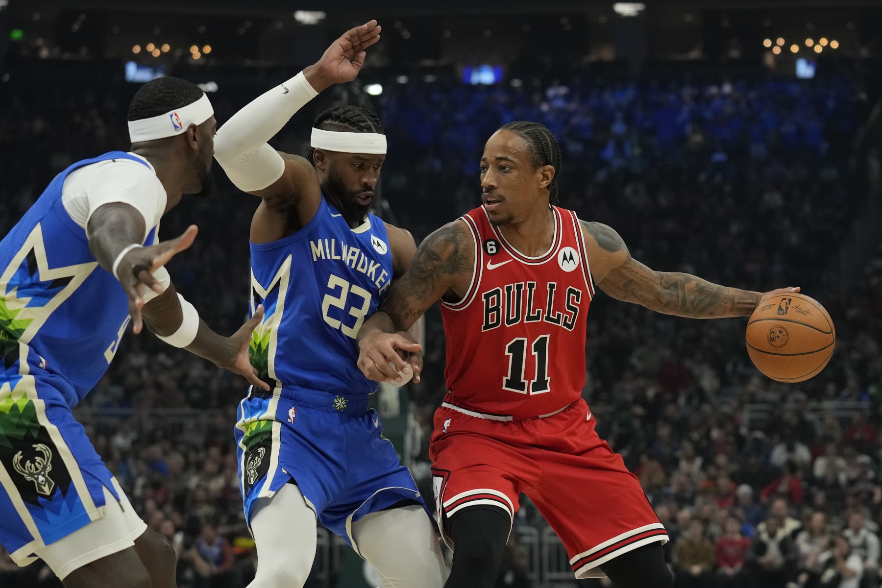 MILWAUKEE, WISCONSIN - NOVEMBER 23: DeMar DeRozan #11 of the Chicago Bulls dribbles the ball against Wesley Matthews #23 of the Milwaukee Bucks during the first half at Fiserv Forum on November 23, 2022 in Milwaukee, Wisconsin. NOTE TO USER: User expressly acknowledges and agrees that, by downloading and or using this photograph, User is consenting to the terms and conditions of the Getty Images License Agreement. (Photo by Patrick McDermott/Getty Images)