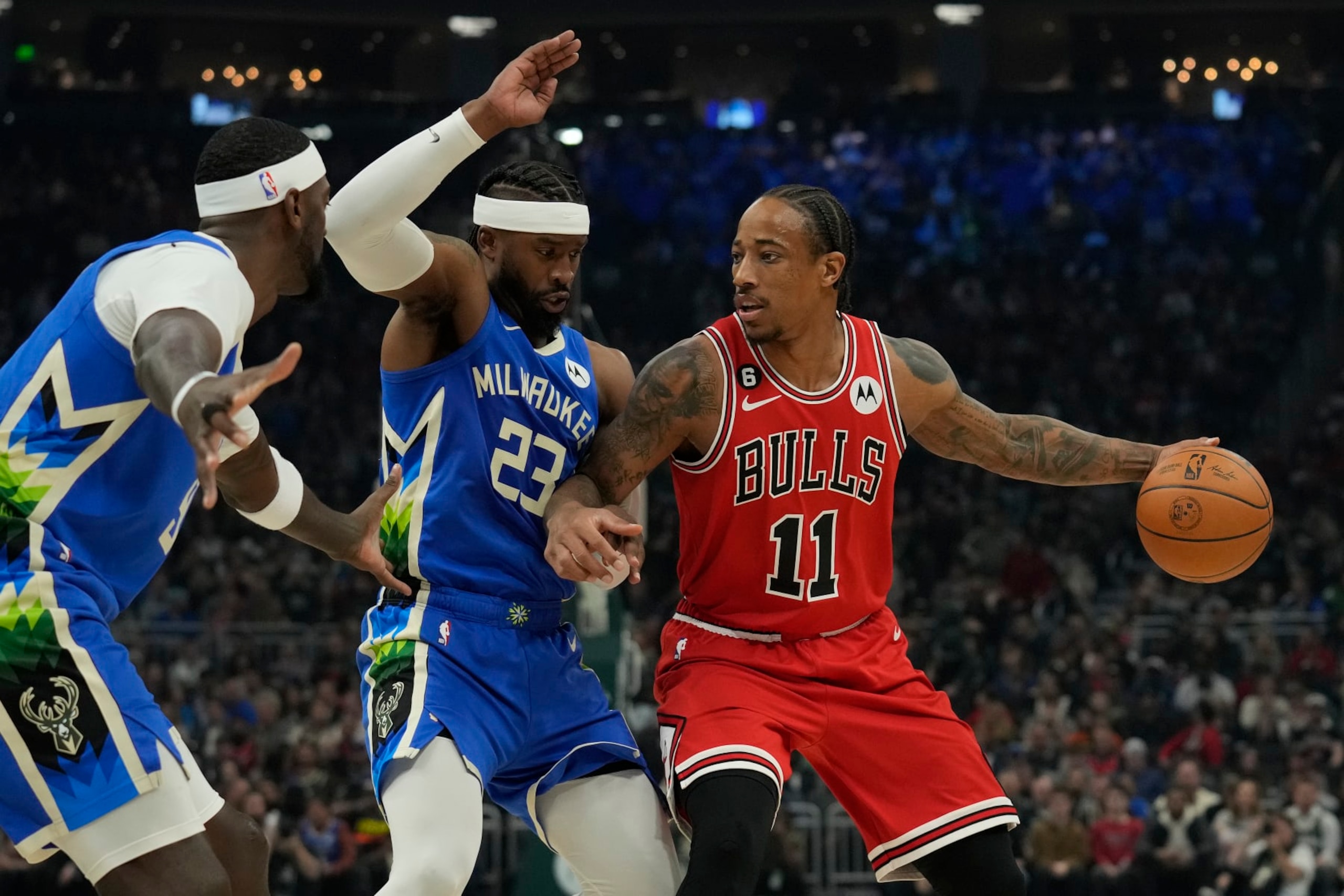 MILWAUKEE, WISCONSIN - NOVEMBER 23: DeMar DeRozan #11 of the Chicago Bulls dribbles the ball against Wesley Matthews #23 of the Milwaukee Bucks during the first half at Fiserv Forum on November 23, 2022 in Milwaukee, Wisconsin. NOTE TO USER: User expressly acknowledges and agrees that, by downloading and or using this photograph, User is consenting to the terms and conditions of the Getty Images License Agreement. (Photo by Patrick McDermott/Getty Images) MILWAUKEE, WISCONSIN - NOVEMBER 23: DeMar DeRozan #11 of the Chicago Bulls dribbles the ball against Wesley Matthews #23 of the Milwaukee Bucks during the first half at Fiserv Forum on November 23, 2022 in Milwaukee, Wisconsin. NOTE TO USER: User expressly acknowledges and agrees that, by downloading and or using this photograph, User is consenting to the terms and conditions of the Getty Images License Agreement. (Photo by Patrick McDermott/Getty Images)
