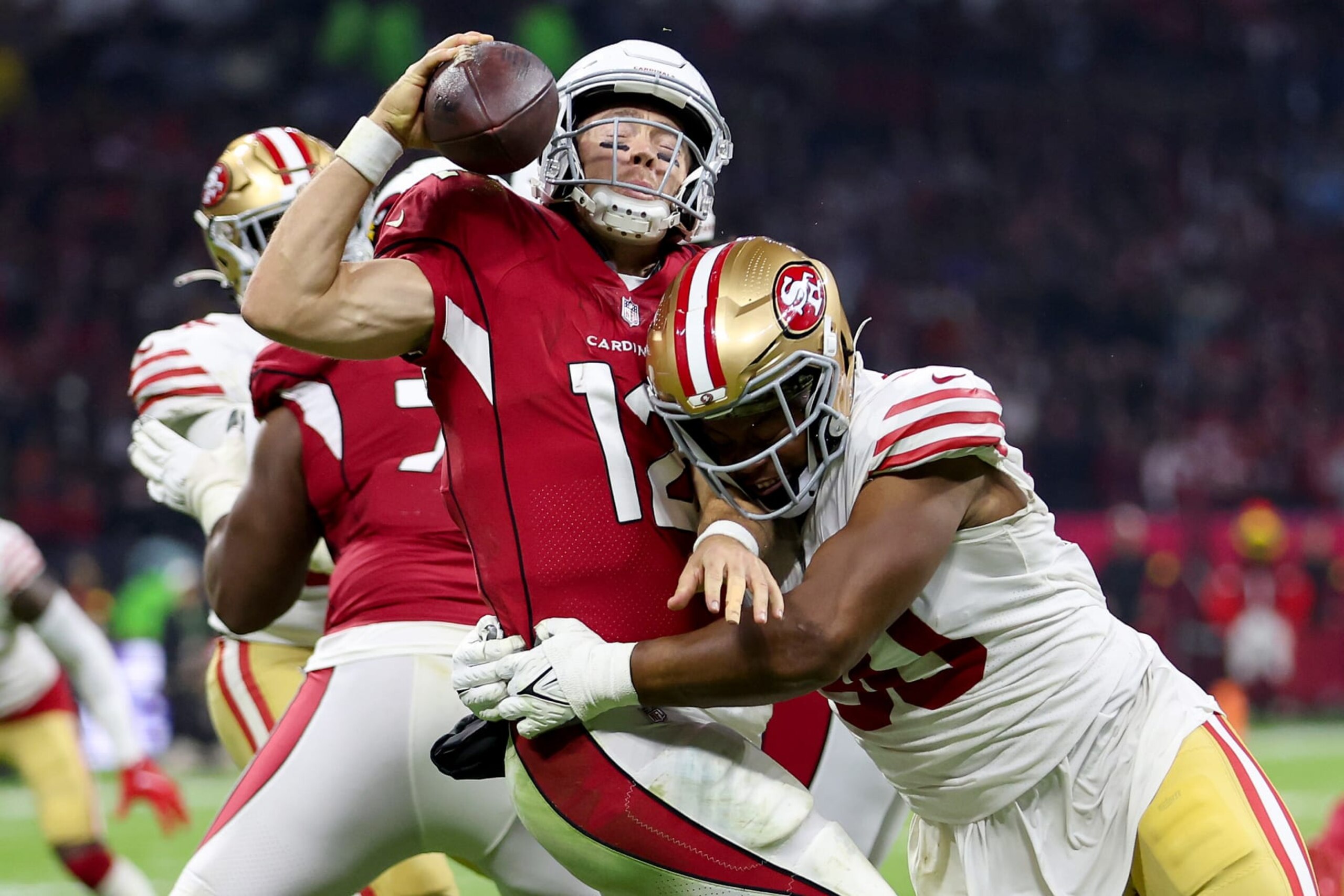 MEXICO CITY, MEXICO - NOVEMBER 21: Kevin Givens #90 of the San Francisco 49ers sacks Colt McCoy #12 of the Arizona Cardinals during the third quarter at Estadio Azteca on November 21, 2022 in Mexico City, Mexico. (Photo by Sean M. Haffey/Getty Images) MEXICO CITY, MEXICO - NOVEMBER 21: Kevin Givens #90 of the San Francisco 49ers sacks Colt McCoy #12 of the Arizona Cardinals during the third quarter at Estadio Azteca on November 21, 2022 in Mexico City, Mexico. (Photo by Sean M. Haffey/Getty Images)